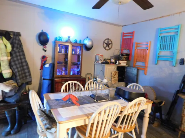 a living room with furniture and a mirror