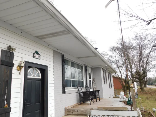 a house with trees in front of it