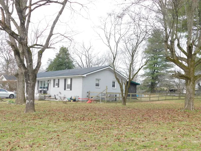 a house with trees in front of it