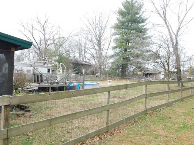 a view of a street with large trees