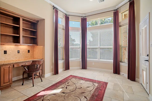 a bedroom with furniture and a window