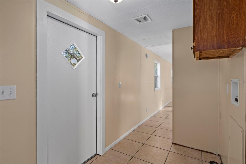 4939 West Foxhill Lane Homosassa, FL 34446 - Photo 12 of 37 a view of an entryway with wooden floor