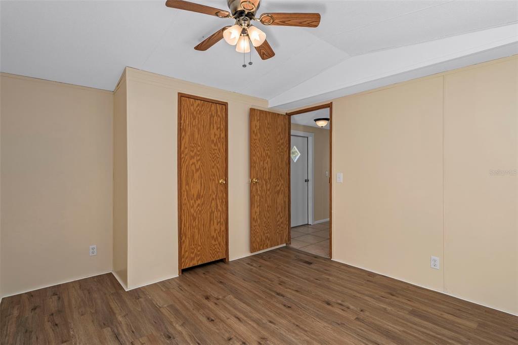 4939 West Foxhill Lane Homosassa, FL 34446 - Photo 16 of 37 a view of an empty room with window and wooden floor