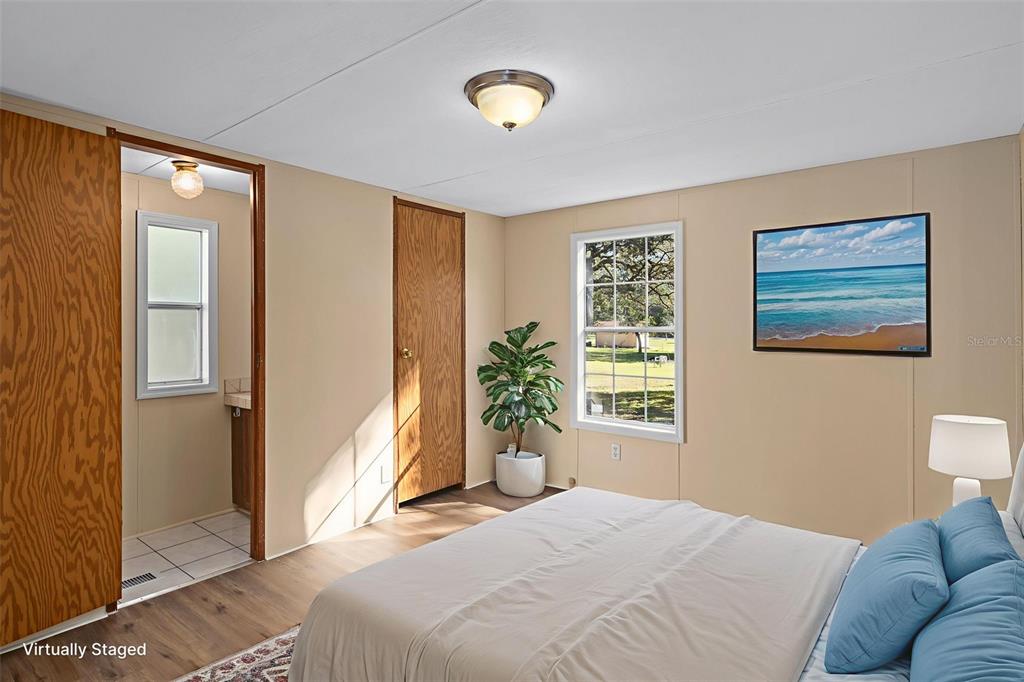 4939 West Foxhill Lane Homosassa, FL 34446 - Photo 17 of 37 a bedroom with a bed and a window