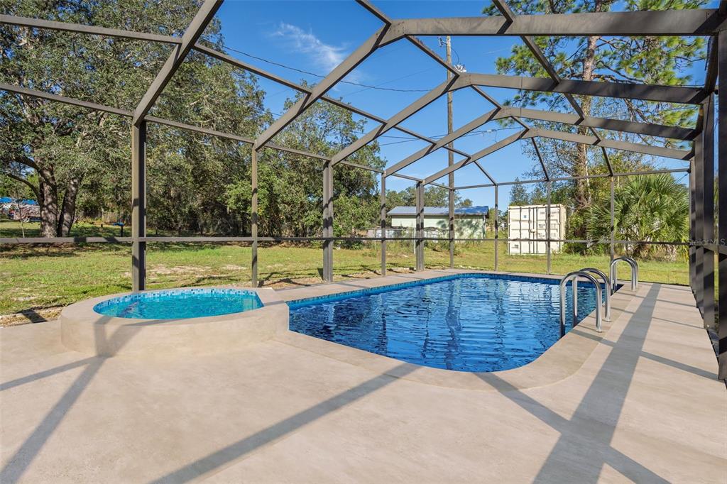 4939 West Foxhill Lane Homosassa, FL 34446 - Photo 22 of 37 a view of a swimming pool with a patio