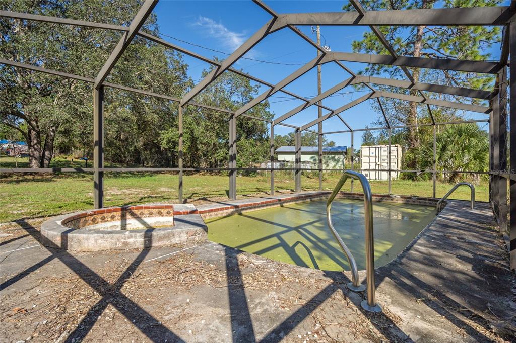4939 West Foxhill Lane Homosassa, FL 34446 - Photo 23 of 37 a view of a swimming pool with a patio