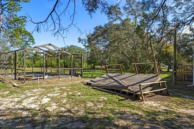 a view of an chairs and tables in the backyard