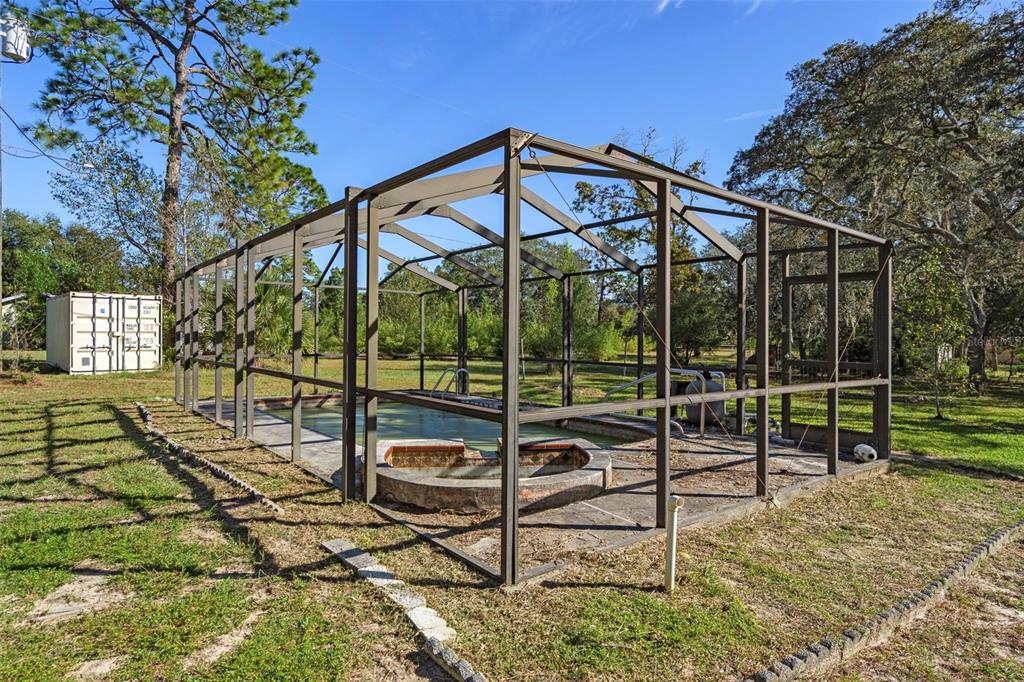 4939 West Foxhill Lane Homosassa, FL 34446 - Photo 26 of 37 a view of an chairs and tables in the backyard