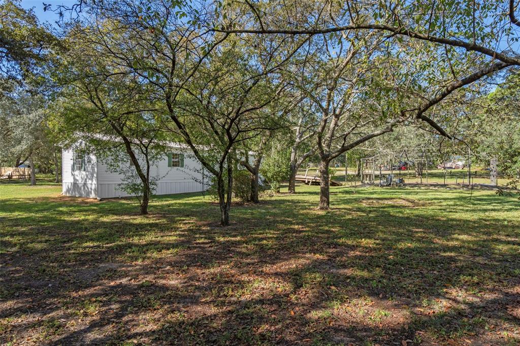 4939 West Foxhill Lane Homosassa, FL 34446 - Photo 28 of 37 a view of a field with large trees