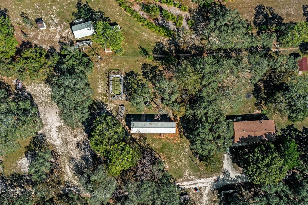 4939 West Foxhill Lane Homosassa, FL 34446 - Photo 36 of 37 an aerial view of residential house with outdoor space and trees all around