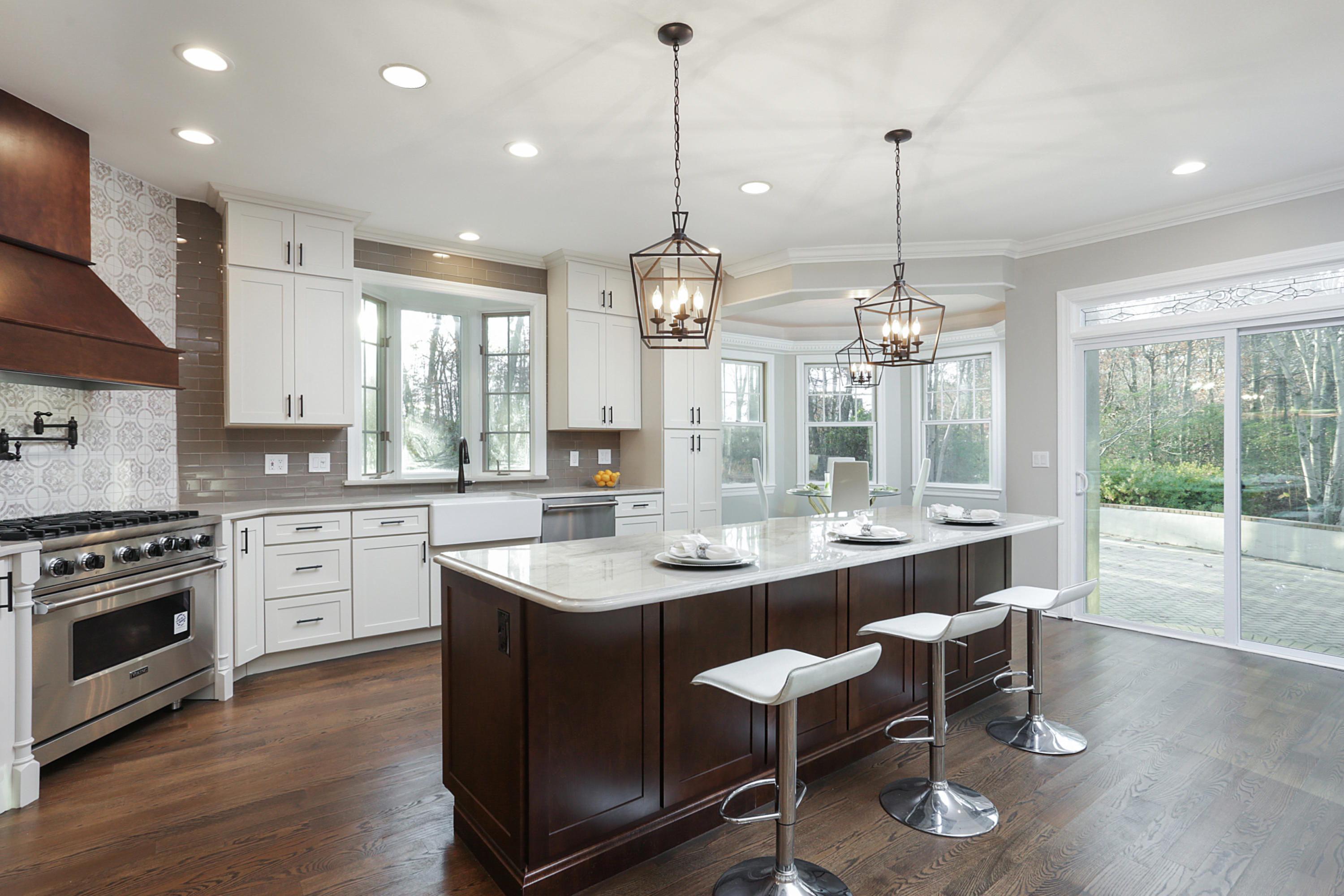 2104 Shadowbrook Drive Wall, NJ 07719 - Photo 20 of 84 a large kitchen with sink a stove and chairs