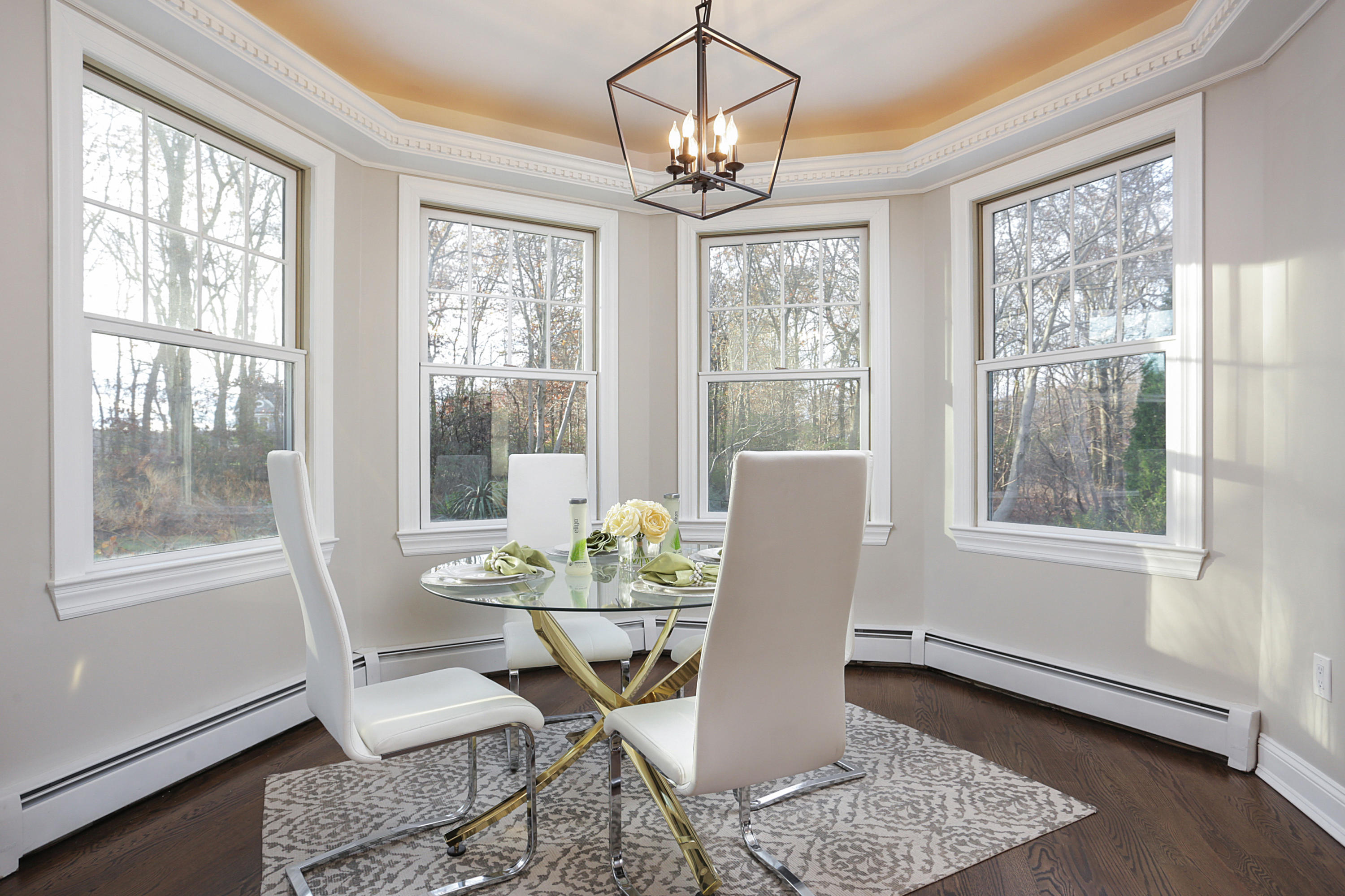 2104 Shadowbrook Drive Wall, NJ 07719 - Photo 25 of 84 a dining room with furniture a chandelier and wooden floor