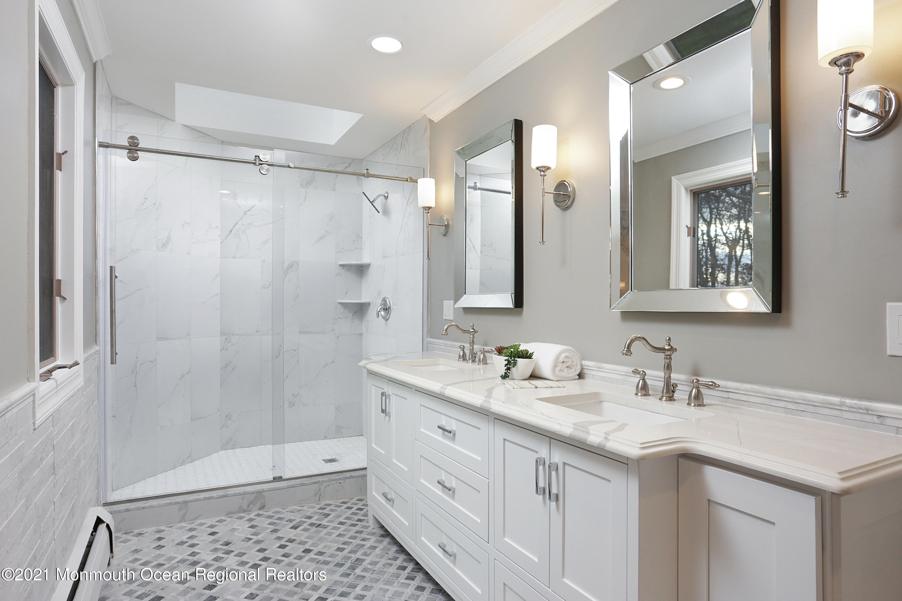 2104 Shadowbrook Drive Wall, NJ 07719 - Photo 32 of 84 a bathroom with a double vanity sink toilet mirror and shower