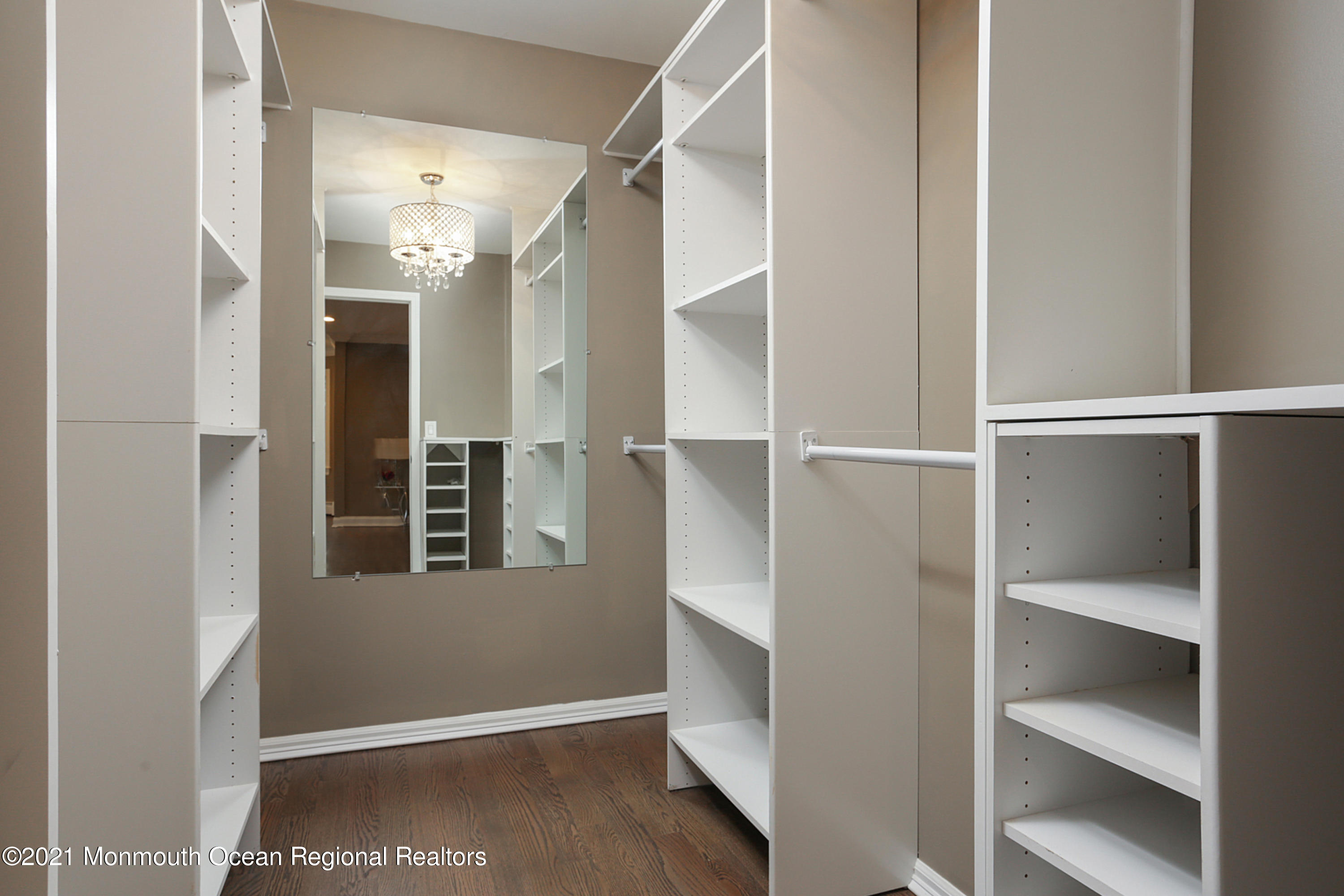 2104 Shadowbrook Drive Wall, NJ 07719 - Photo 34 of 84 a view of an empty room with wooden floor and closet