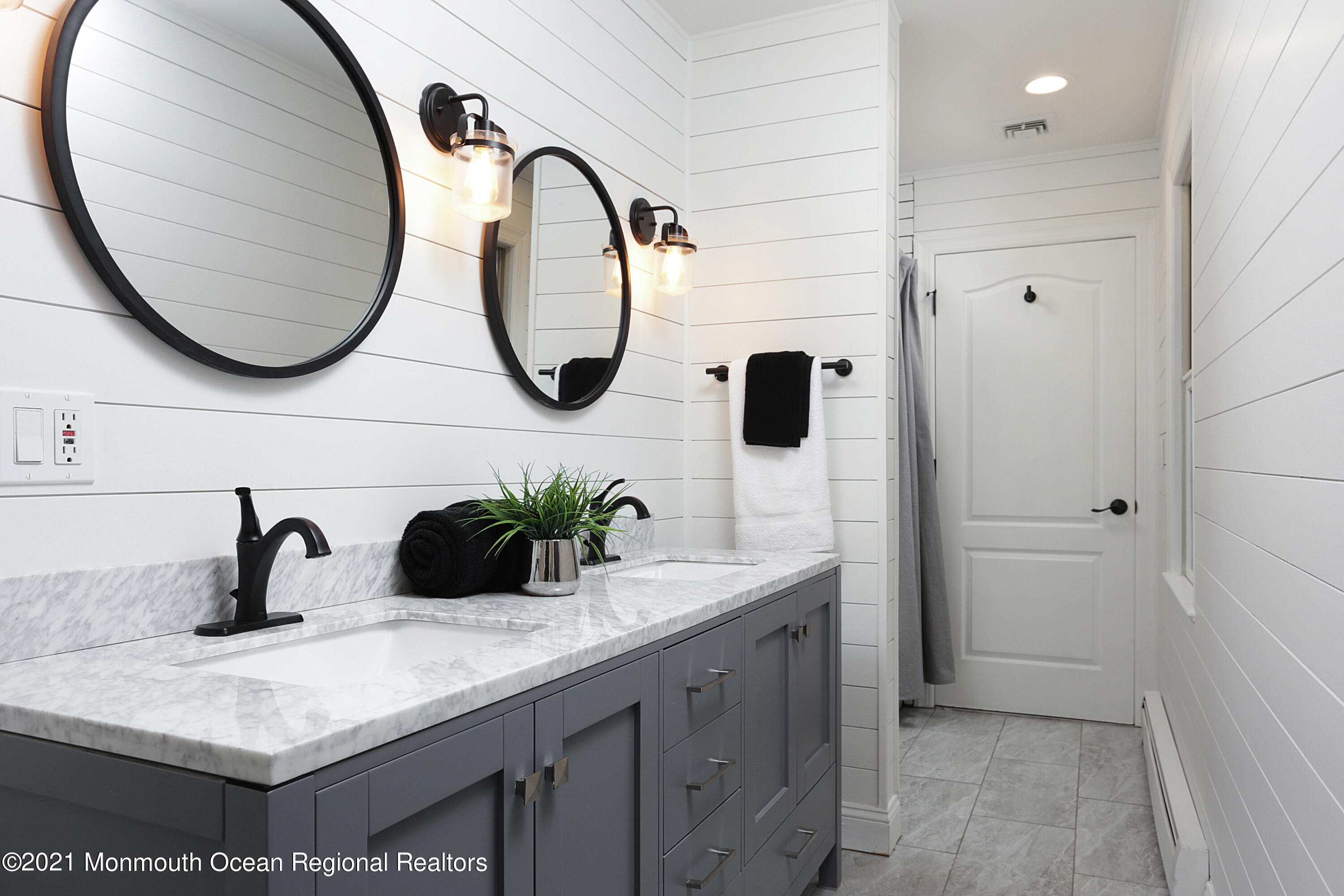 2104 Shadowbrook Drive Wall, NJ 07719 - Photo 37 of 84 a bathroom with a sink and a mirror