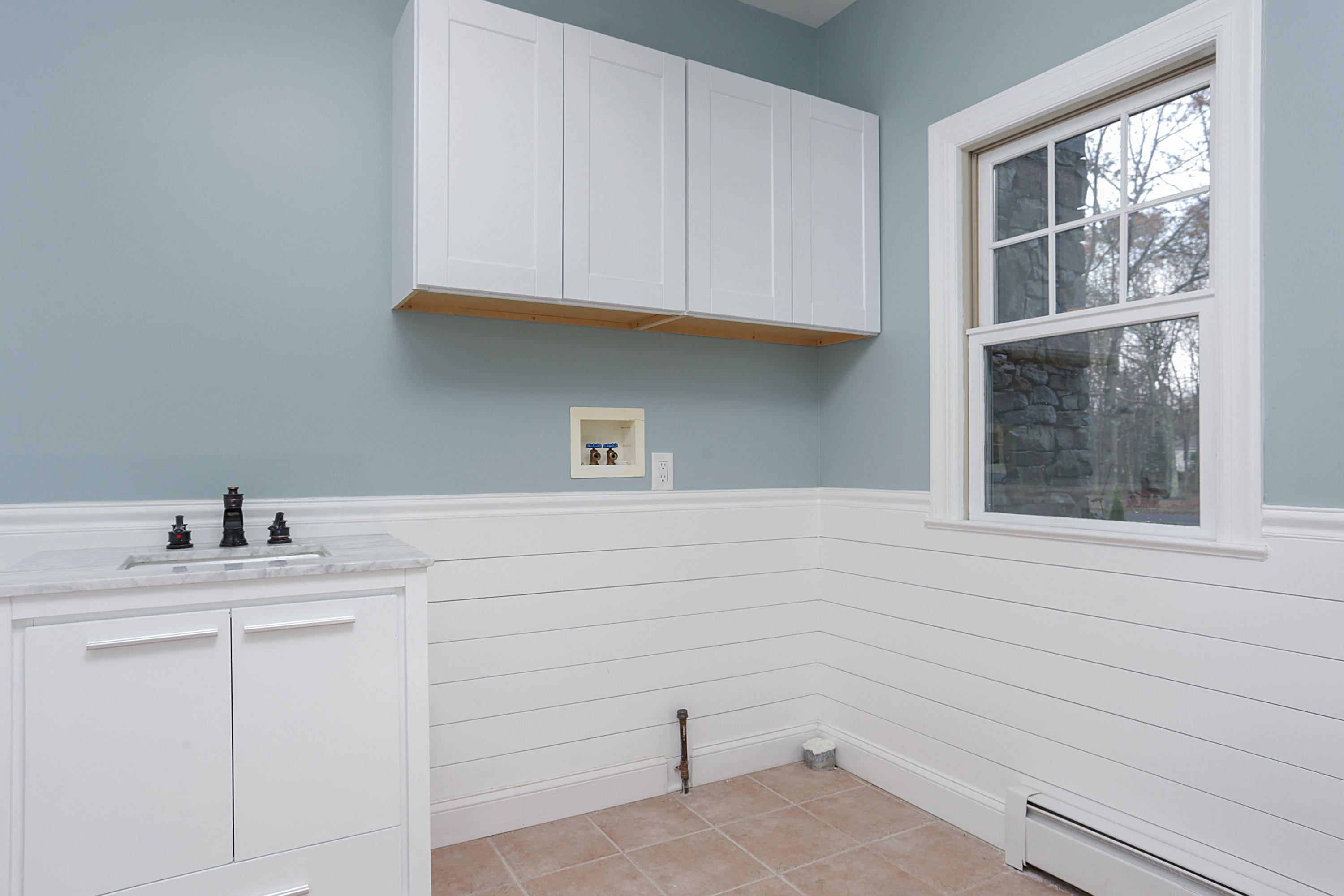 2104 Shadowbrook Drive Wall, NJ 07719 - Photo 39 of 84 a bathroom with a sink and cabinets