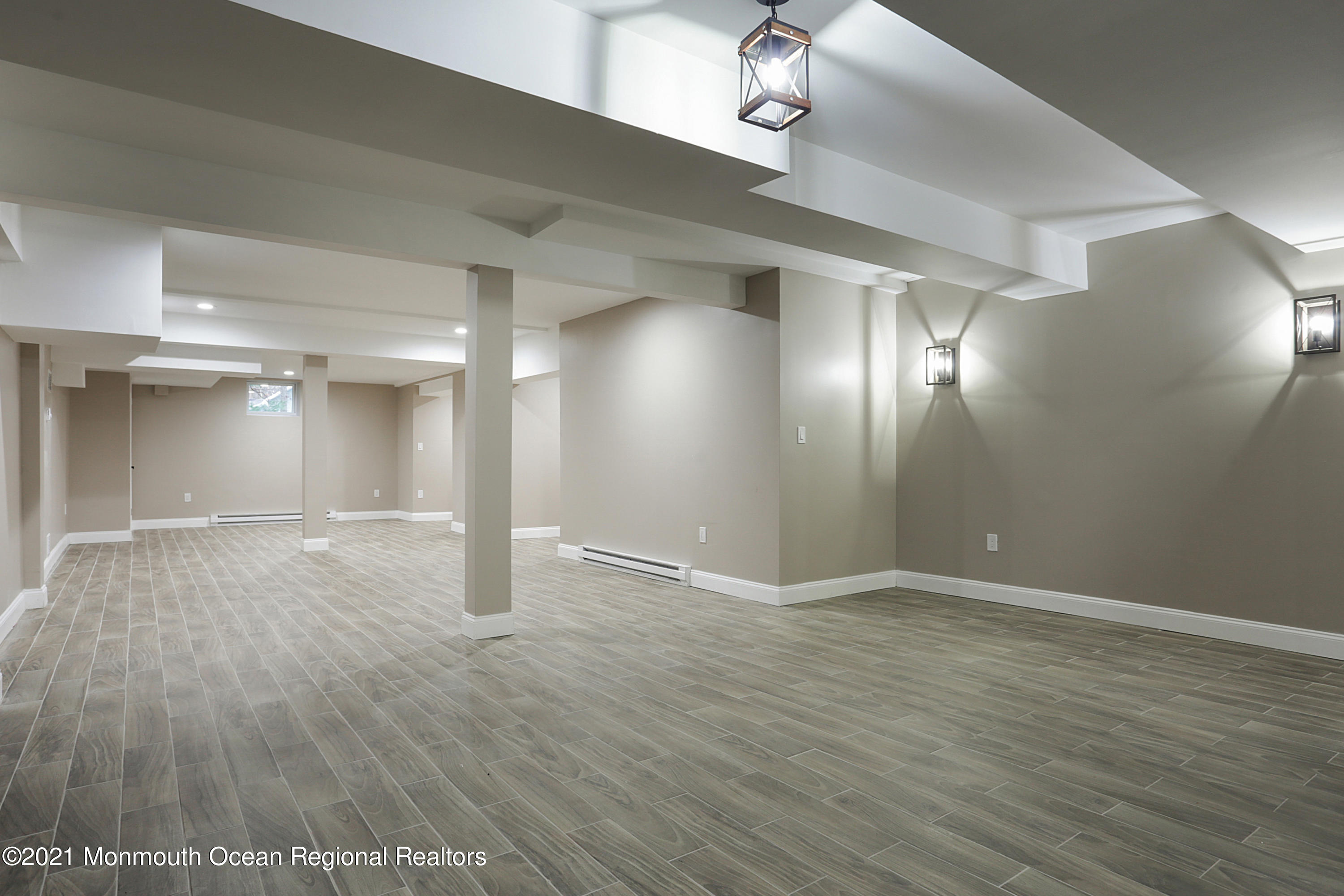 2104 Shadowbrook Drive Wall, NJ 07719 - Photo 41 of 84 a view of an empty room with wooden floor