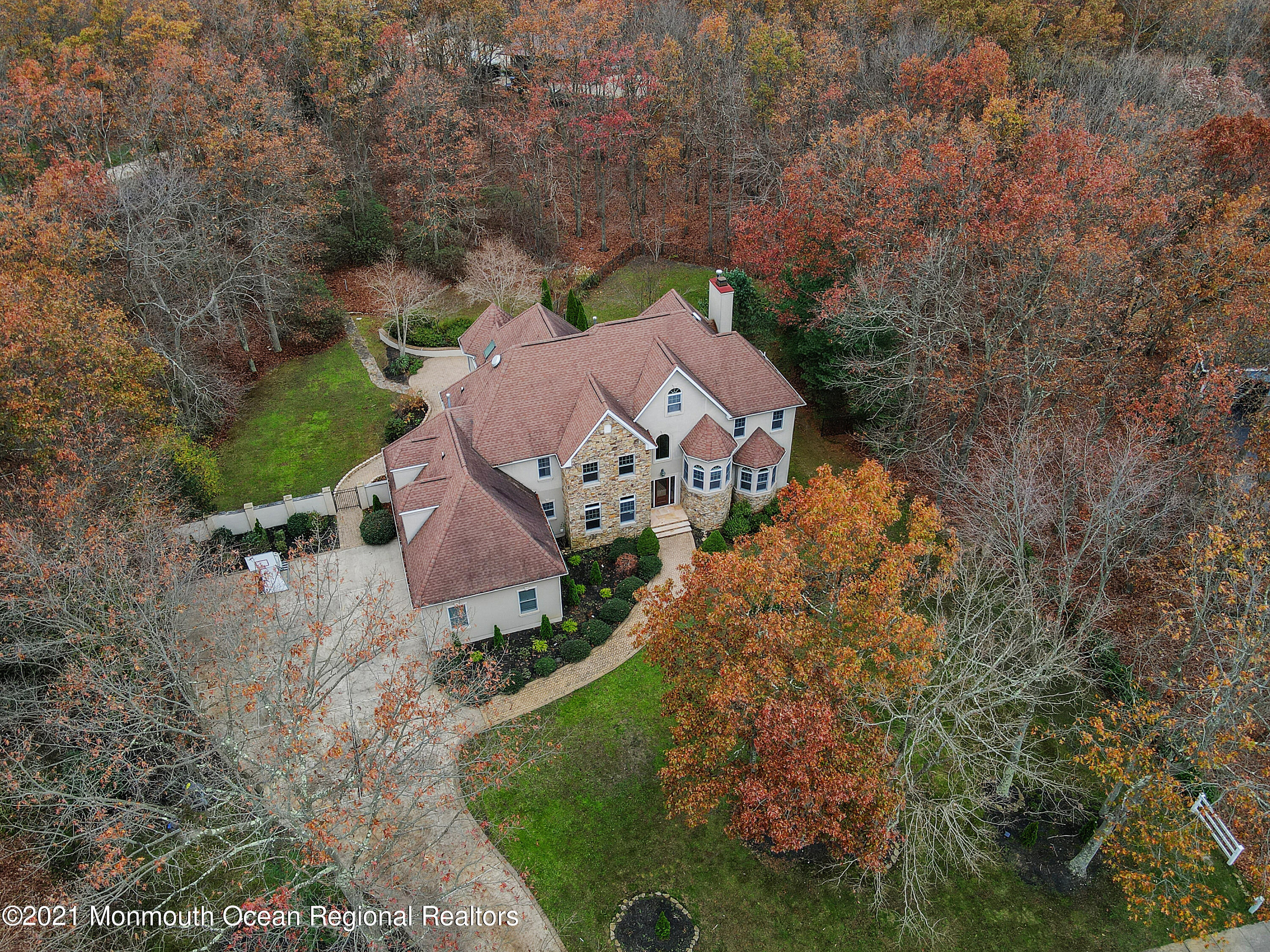 2104 Shadowbrook Drive Wall, NJ 07719 - Photo 51 of 84 an aerial view of a house with a garden
