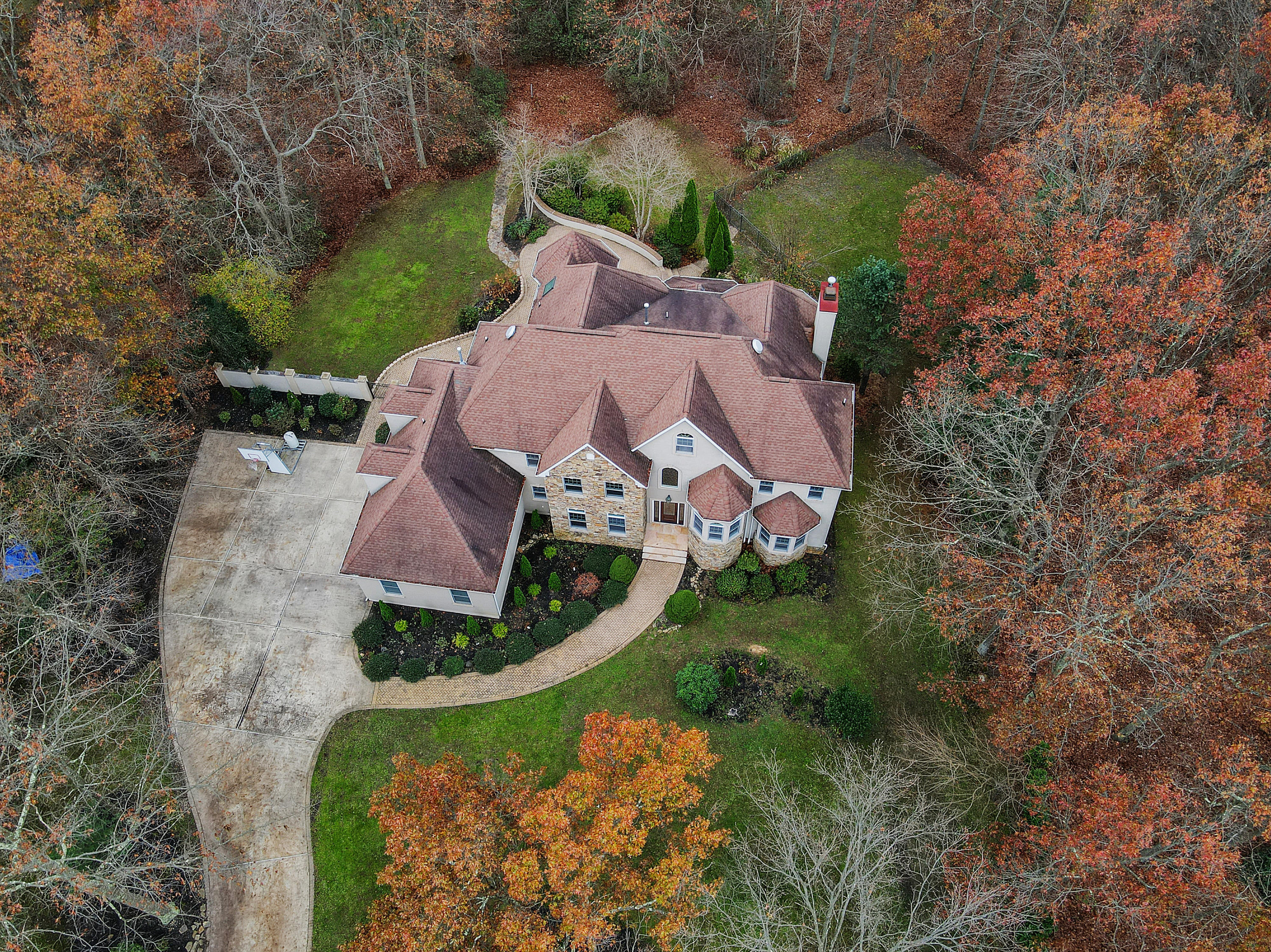 2104 Shadowbrook Drive Wall, NJ 07719 - Photo 52 of 84 an aerial view of a house with a yard and lake