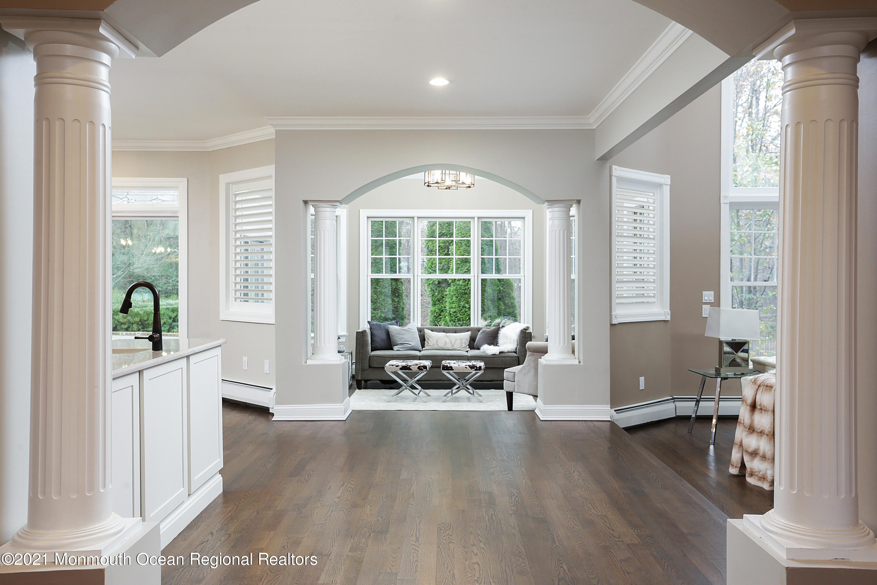 2104 Shadowbrook Drive Wall, NJ 07719 - Photo 10 of 84 a living room with furniture and floor to ceiling windows