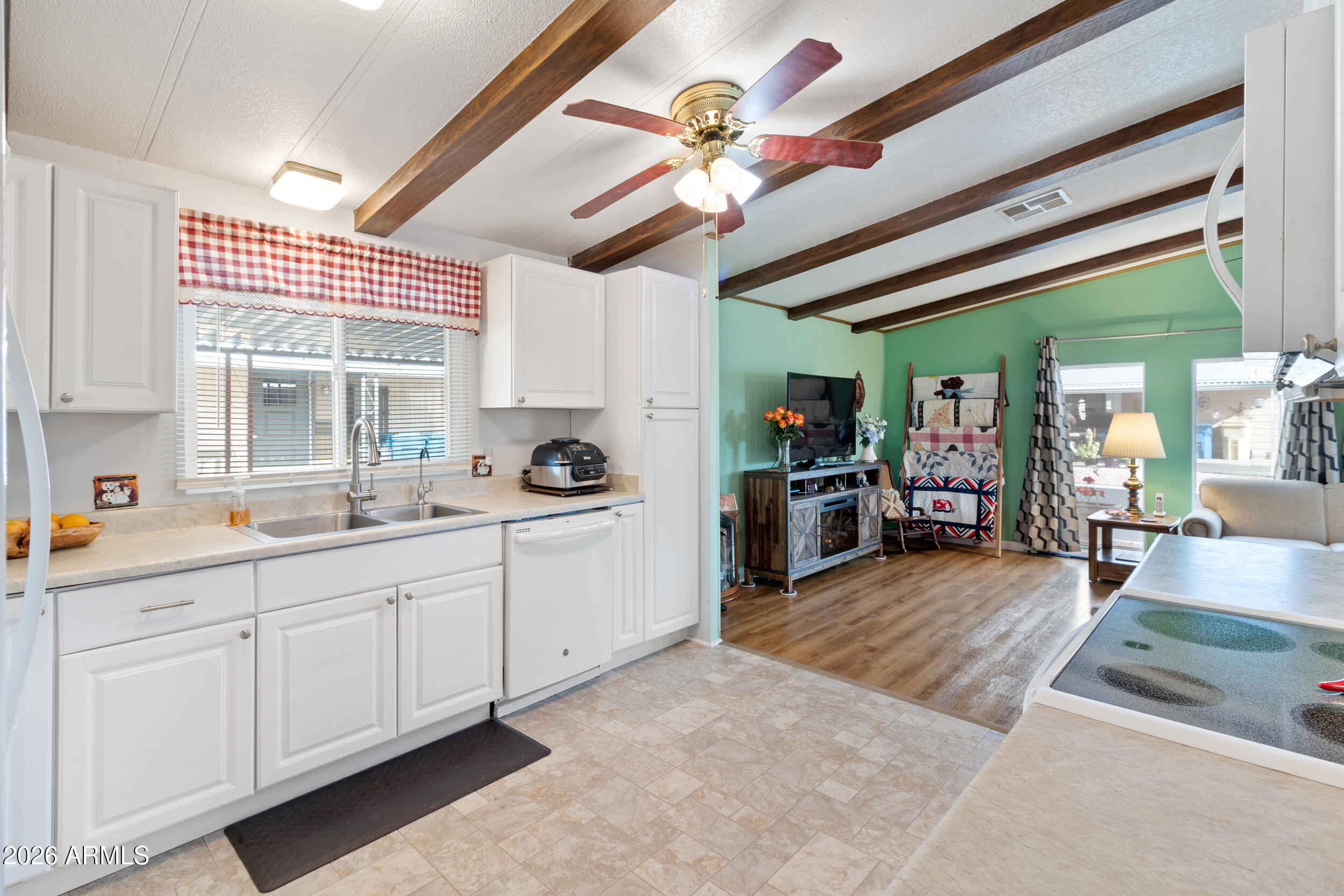 9302 East Broadway Road, Unit 178 Mesa, AZ 85208 - Photo 1 of 56 a large white kitchen with a large window