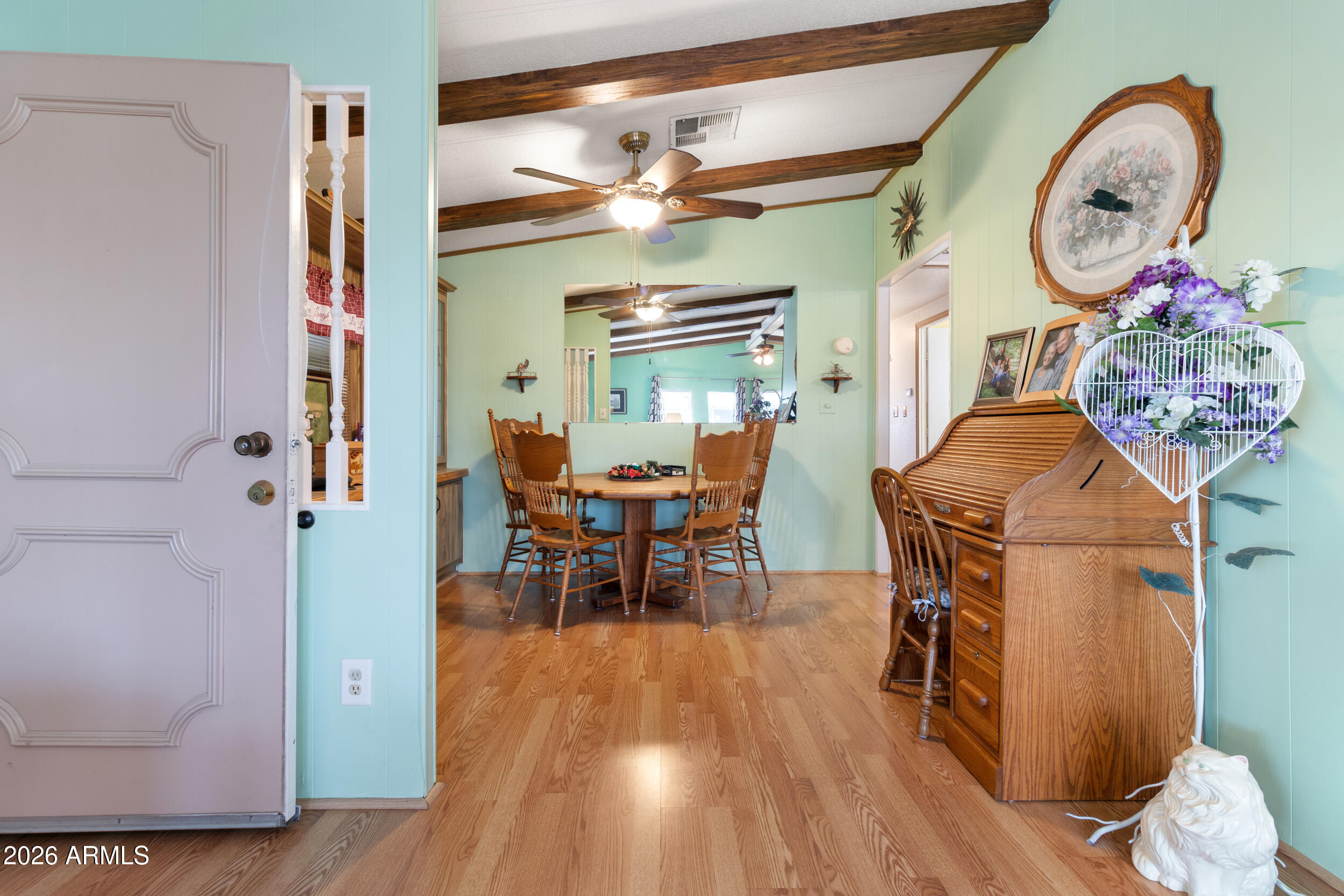 9302 East Broadway Road, Unit 178 Mesa, AZ 85208 - Photo 14 of 56 a dining room with furniture and wooden floor
