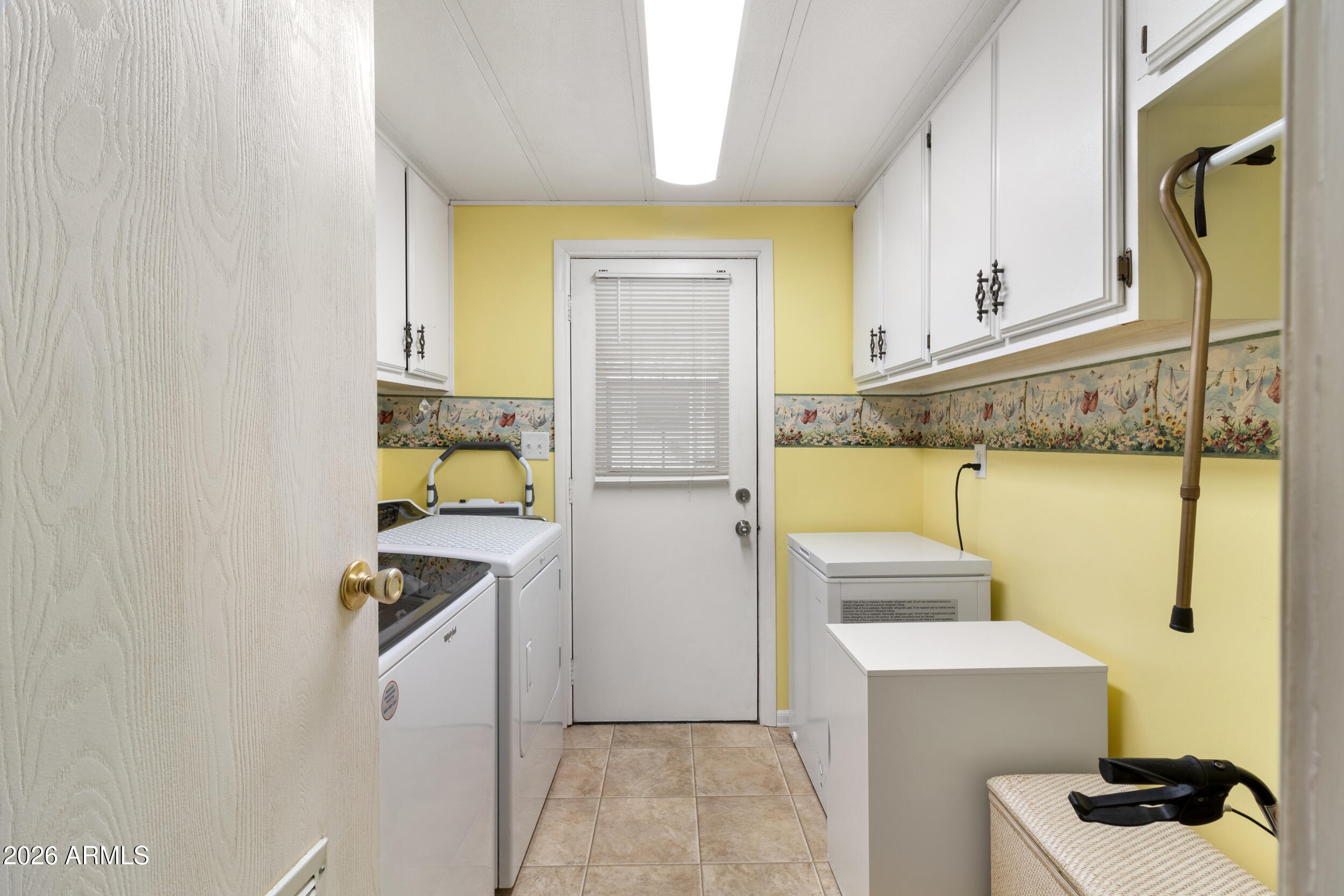 9302 East Broadway Road, Unit 178 Mesa, AZ 85208 - Photo 16 of 56 a view of walk in closet with clothes and shoes