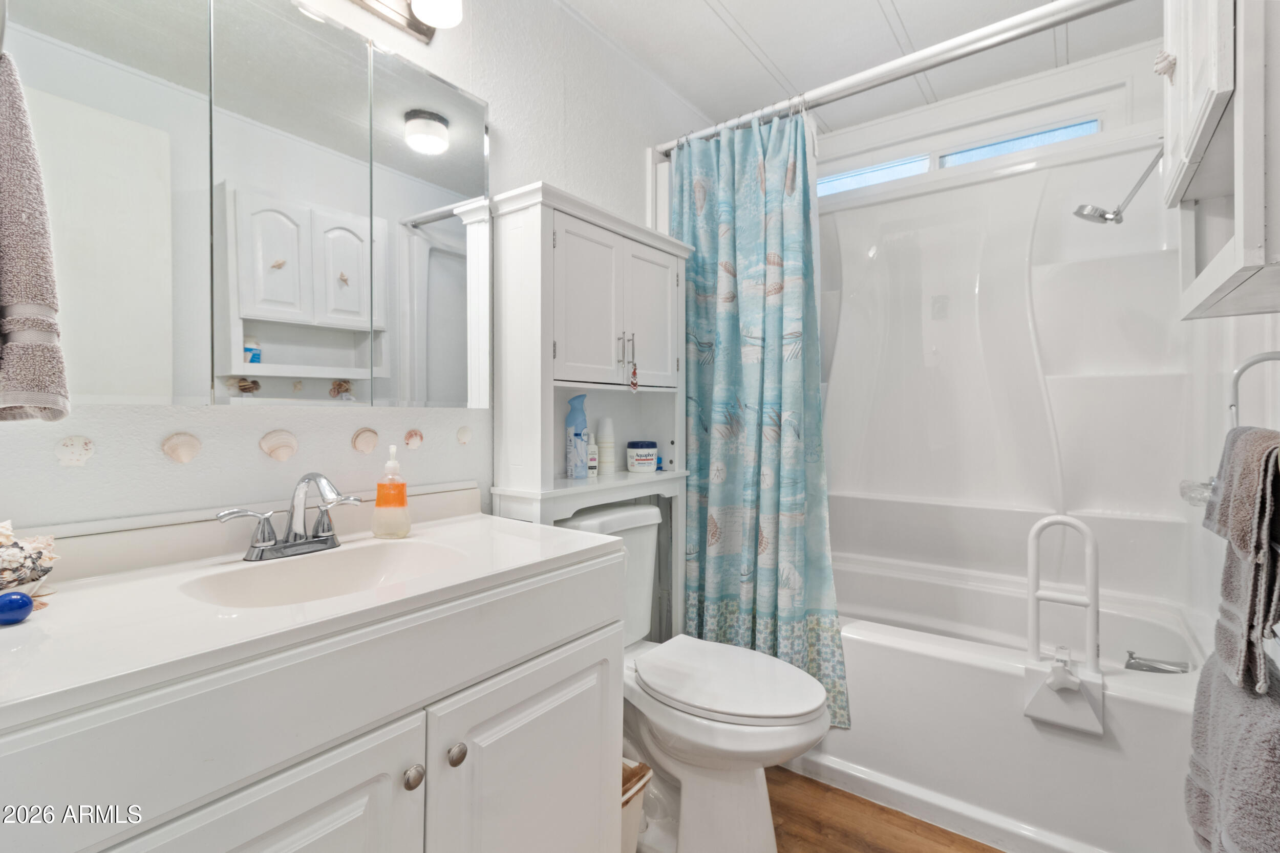 9302 East Broadway Road, Unit 178 Mesa, AZ 85208 - Photo 20 of 56 a bathroom with a sink toilet and shower