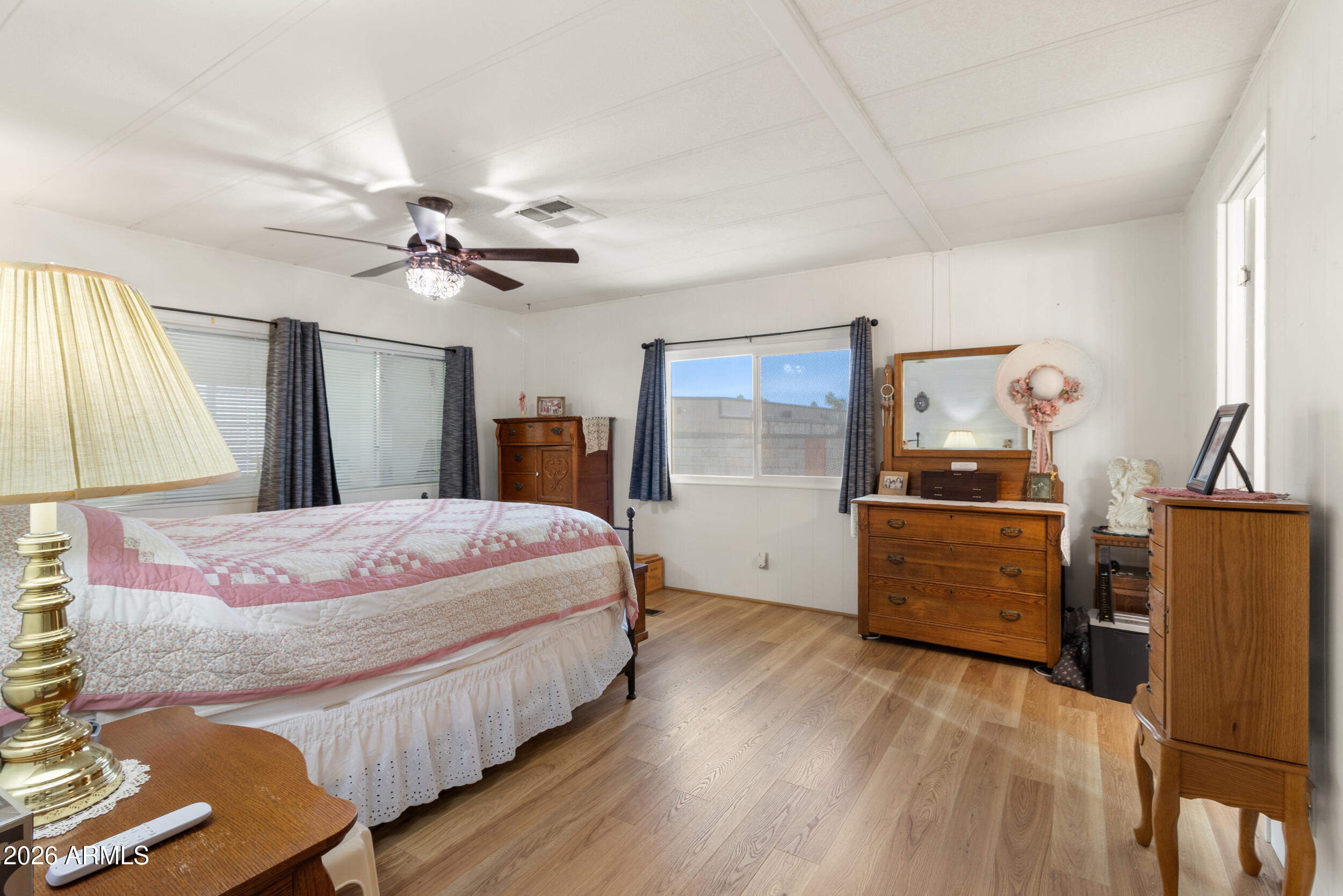 9302 East Broadway Road, Unit 178 Mesa, AZ 85208 - Photo 21 of 56 a bedroom with a bed dresser and a window