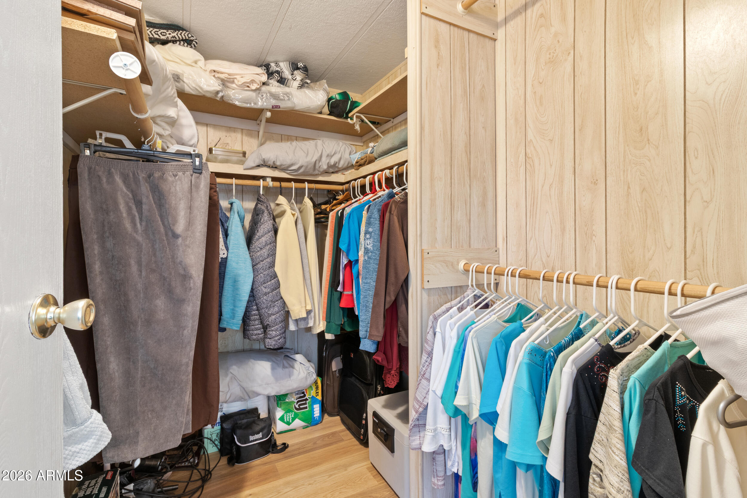 9302 East Broadway Road, Unit 178 Mesa, AZ 85208 - Photo 24 of 56 a view of walk in closet with clothes