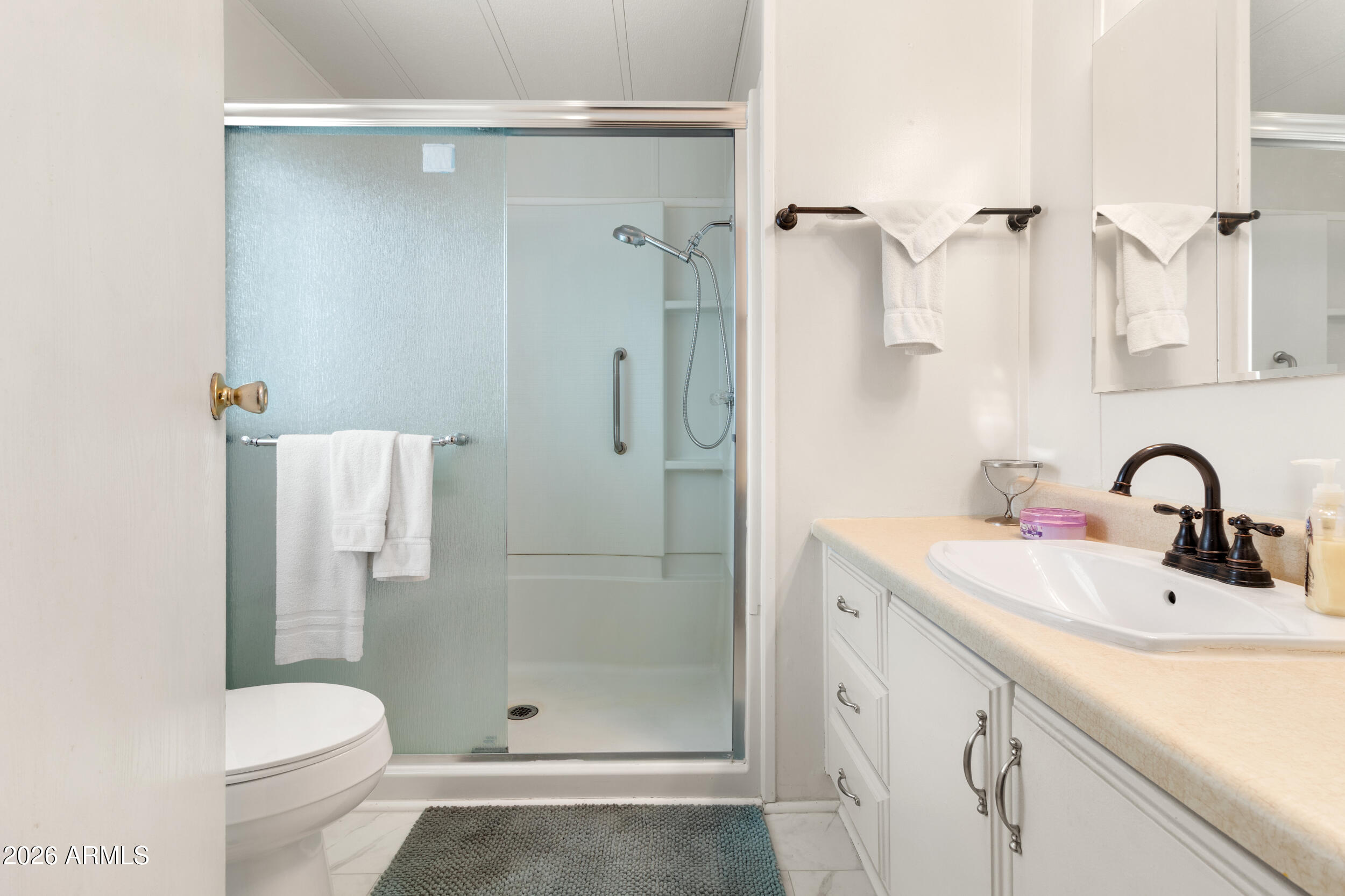 9302 East Broadway Road, Unit 178 Mesa, AZ 85208 - Photo 26 of 56 a bathroom with a sink toilet and shower