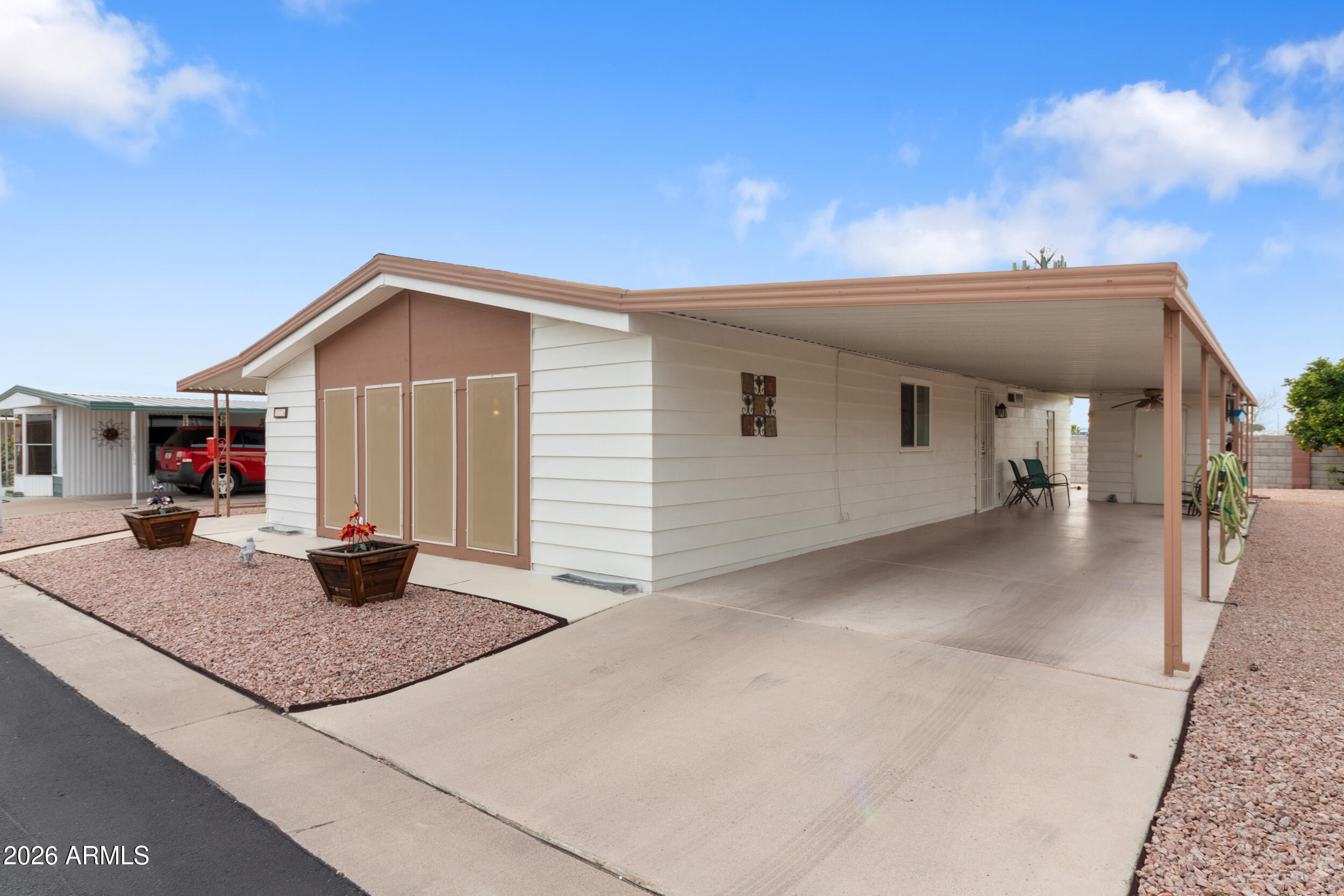 9302 East Broadway Road, Unit 178 Mesa, AZ 85208 - Photo 28 of 56 a view of a house with backyard