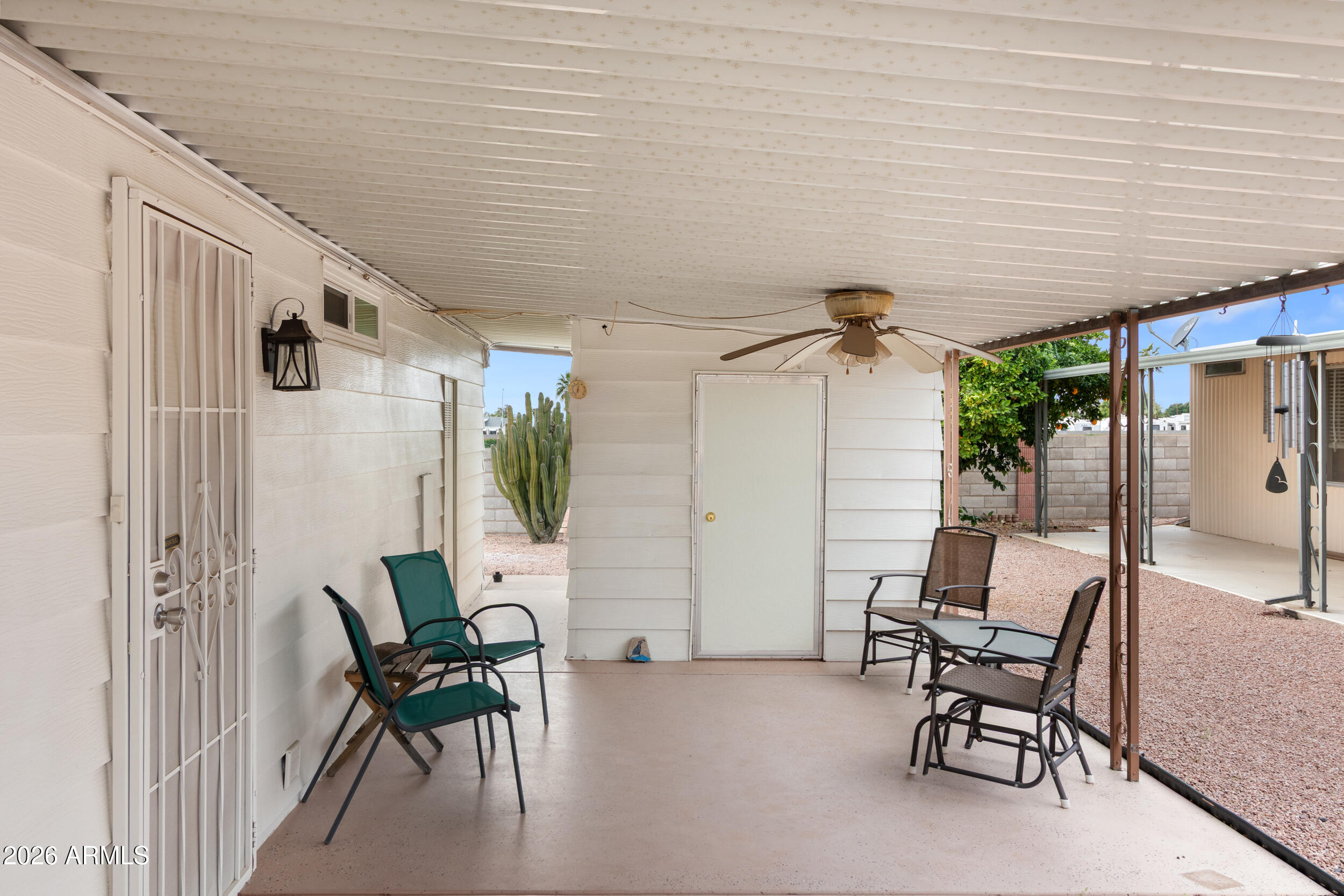 9302 East Broadway Road, Unit 178 Mesa, AZ 85208 - Photo 29 of 56 a balcony with table and chairs