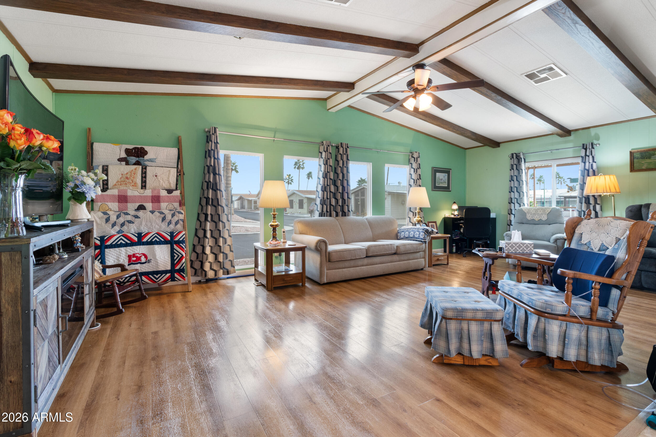 9302 East Broadway Road, Unit 178 Mesa, AZ 85208 - Photo 3 of 56 a living room with furniture and a wooden floor