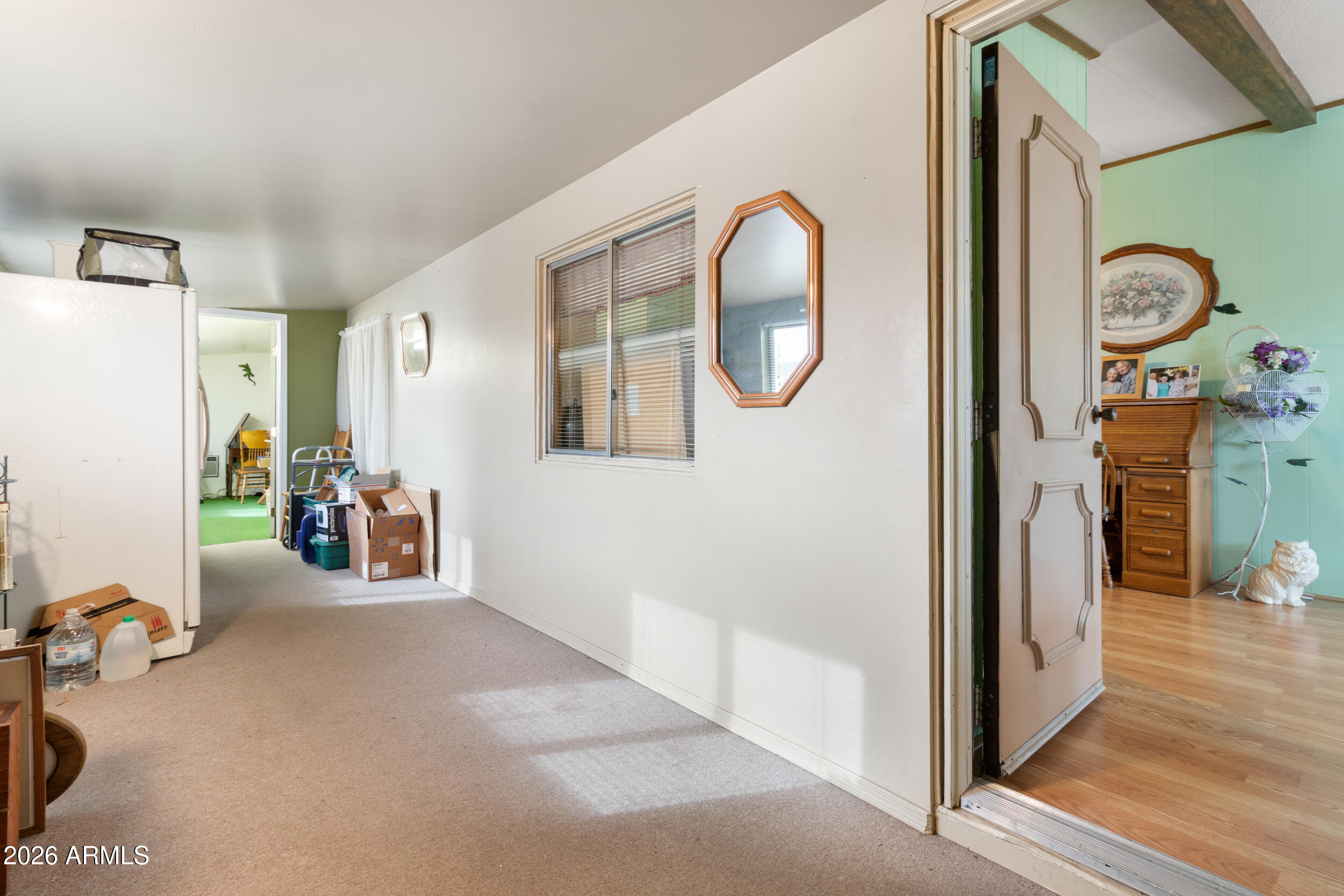 9302 East Broadway Road, Unit 178 Mesa, AZ 85208 - Photo 33 of 56 a view of a livingroom with furniture and hardwood floor