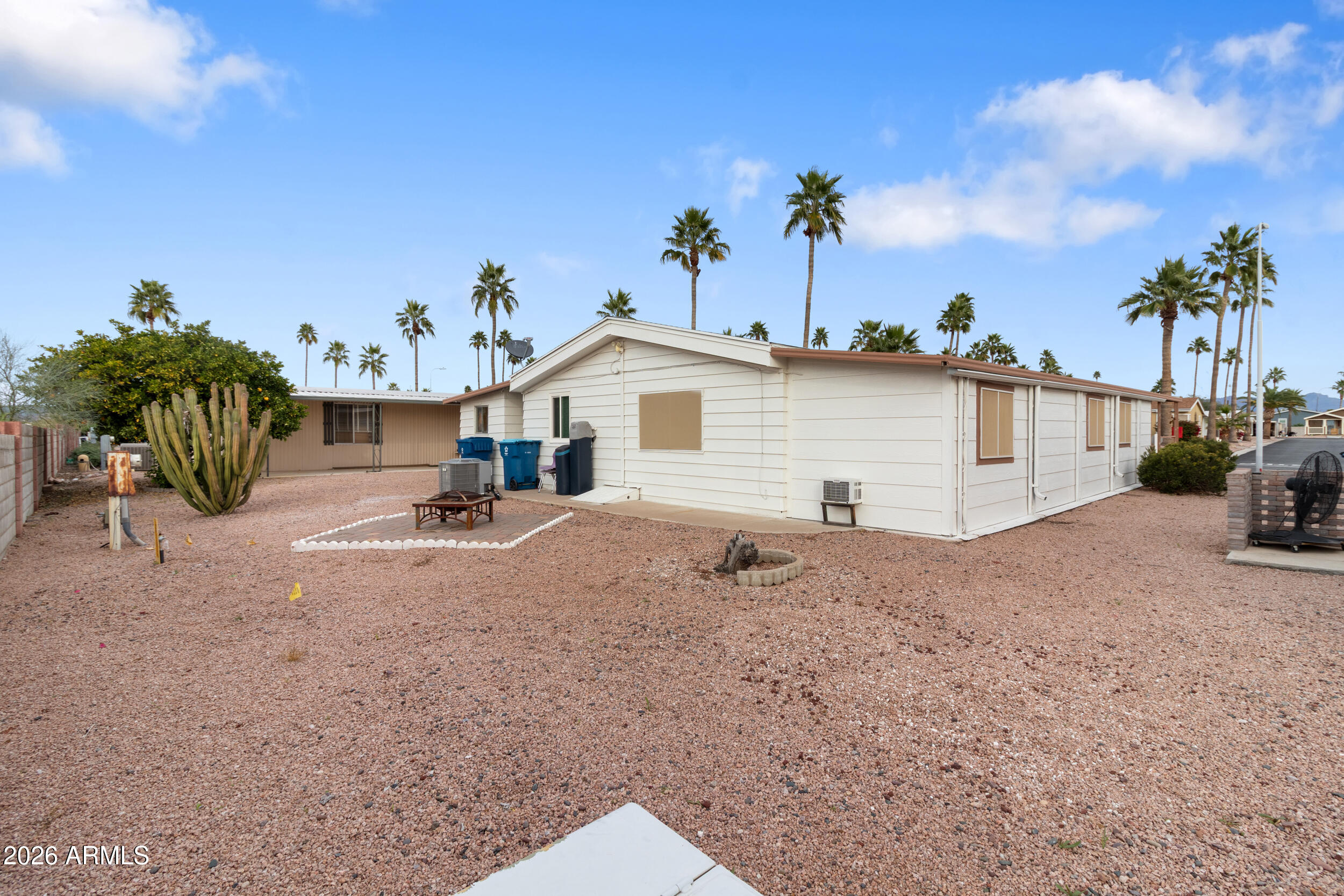 9302 East Broadway Road, Unit 178 Mesa, AZ 85208 - Photo 39 of 56 a view of a house with backyard and sitting area