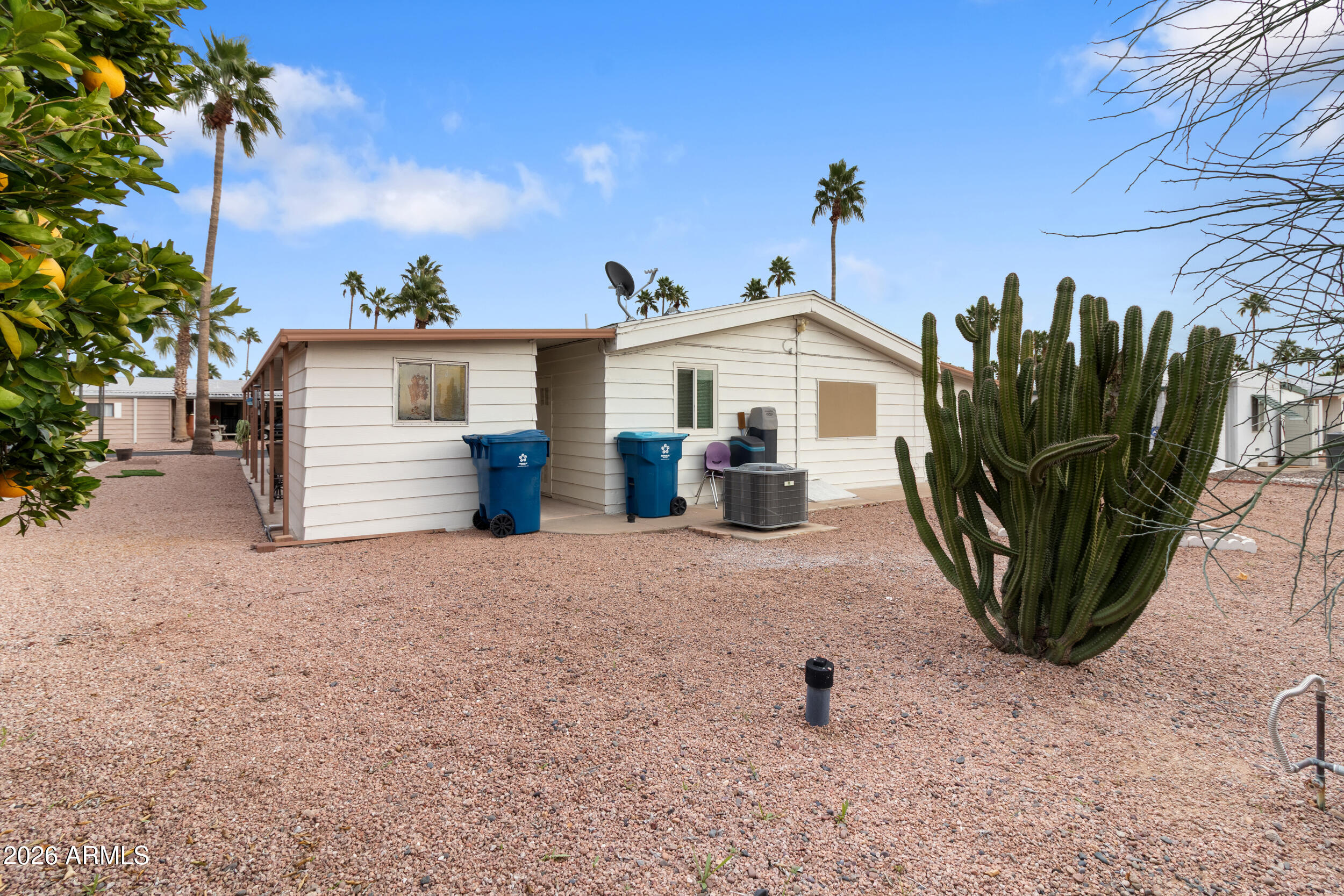 9302 East Broadway Road, Unit 178 Mesa, AZ 85208 - Photo 40 of 56 a view of a street with a view of a garage