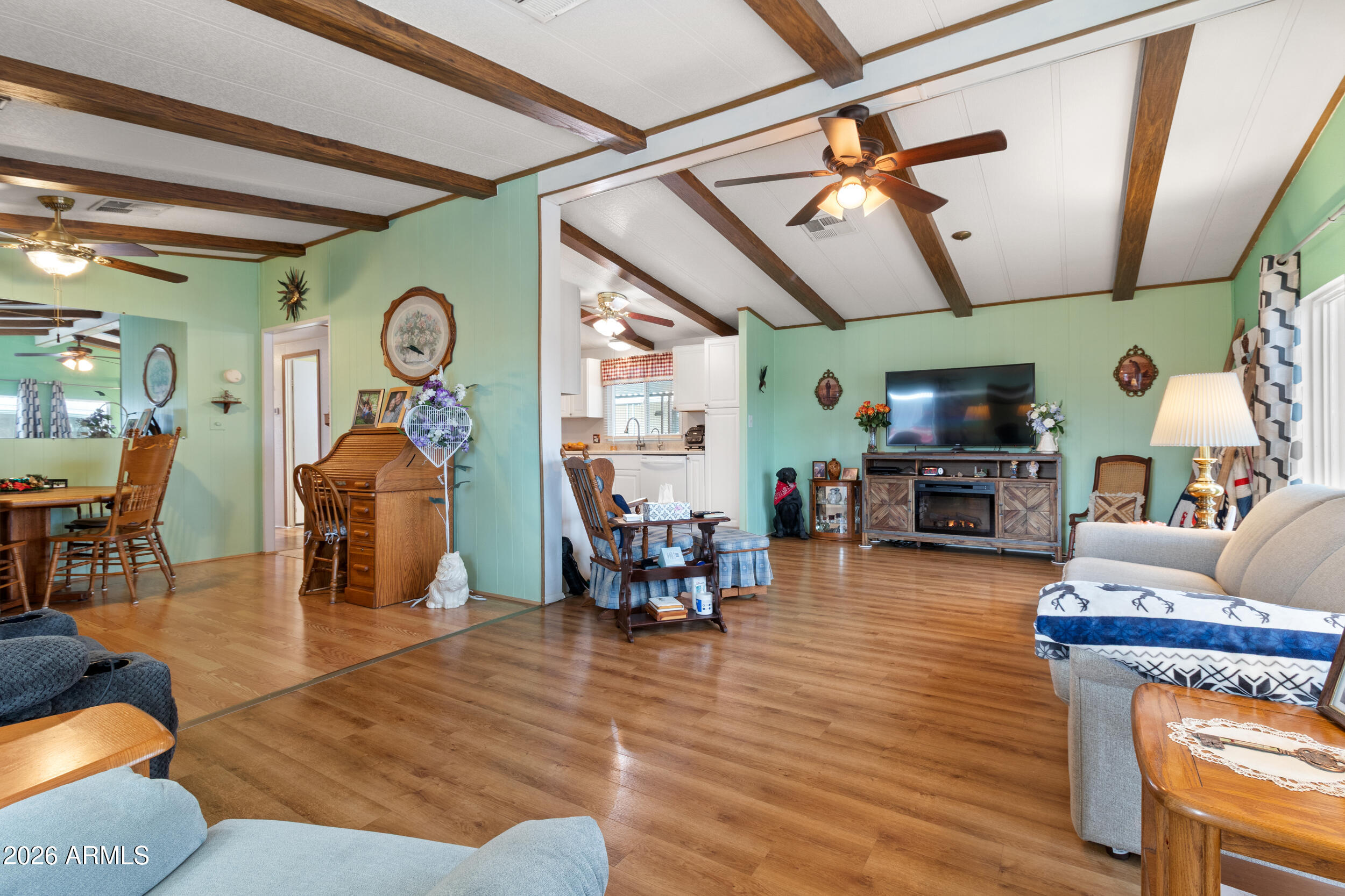 9302 East Broadway Road, Unit 178 Mesa, AZ 85208 - Photo 4 of 56 a living room with furniture and wooden floors