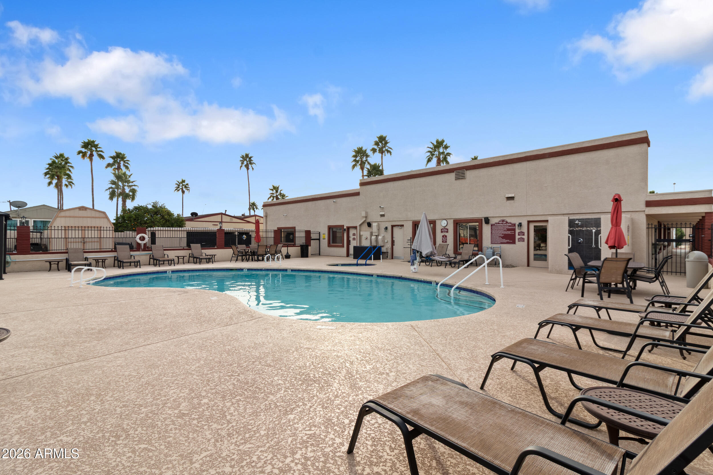 9302 East Broadway Road, Unit 178 Mesa, AZ 85208 - Photo 43 of 56 a view of a house with swimming pool and sitting area