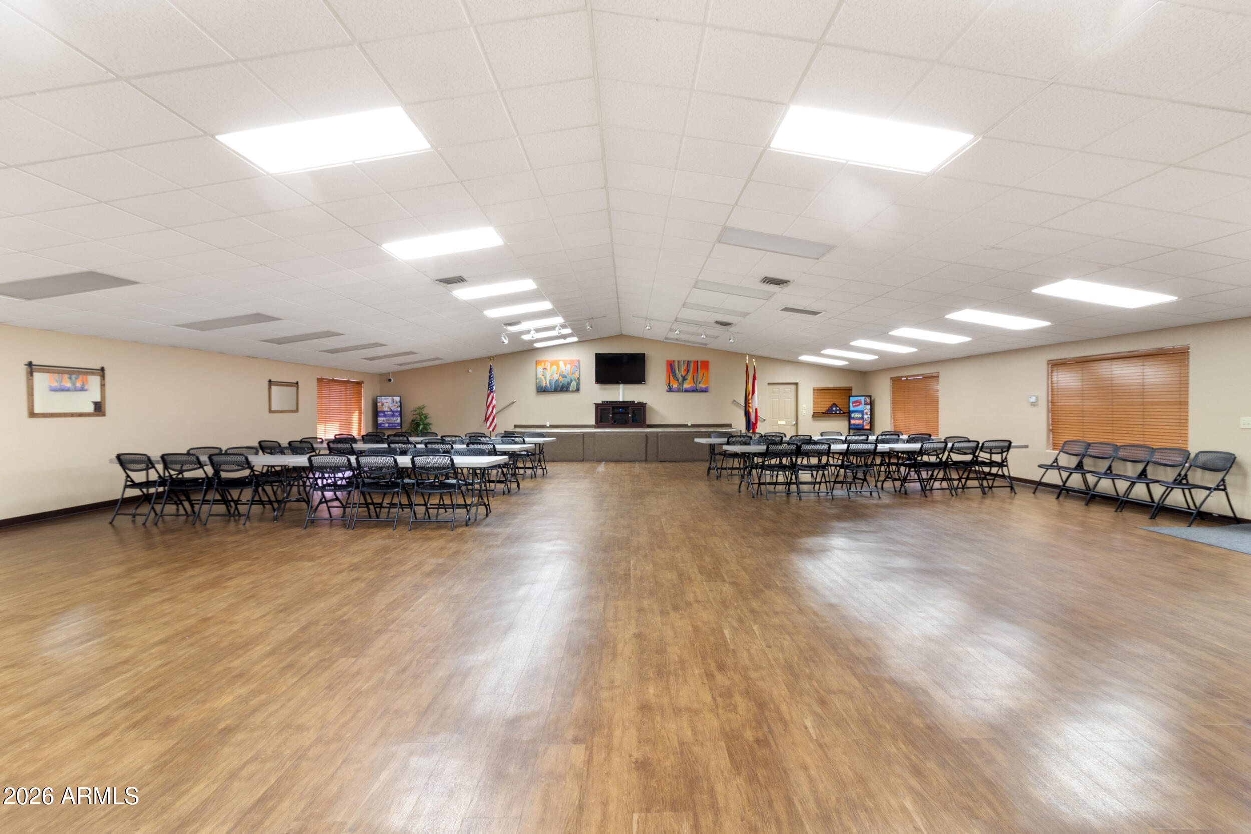9302 East Broadway Road, Unit 178 Mesa, AZ 85208 - Photo 46 of 56 a room with lots of furniture and a wooden floor