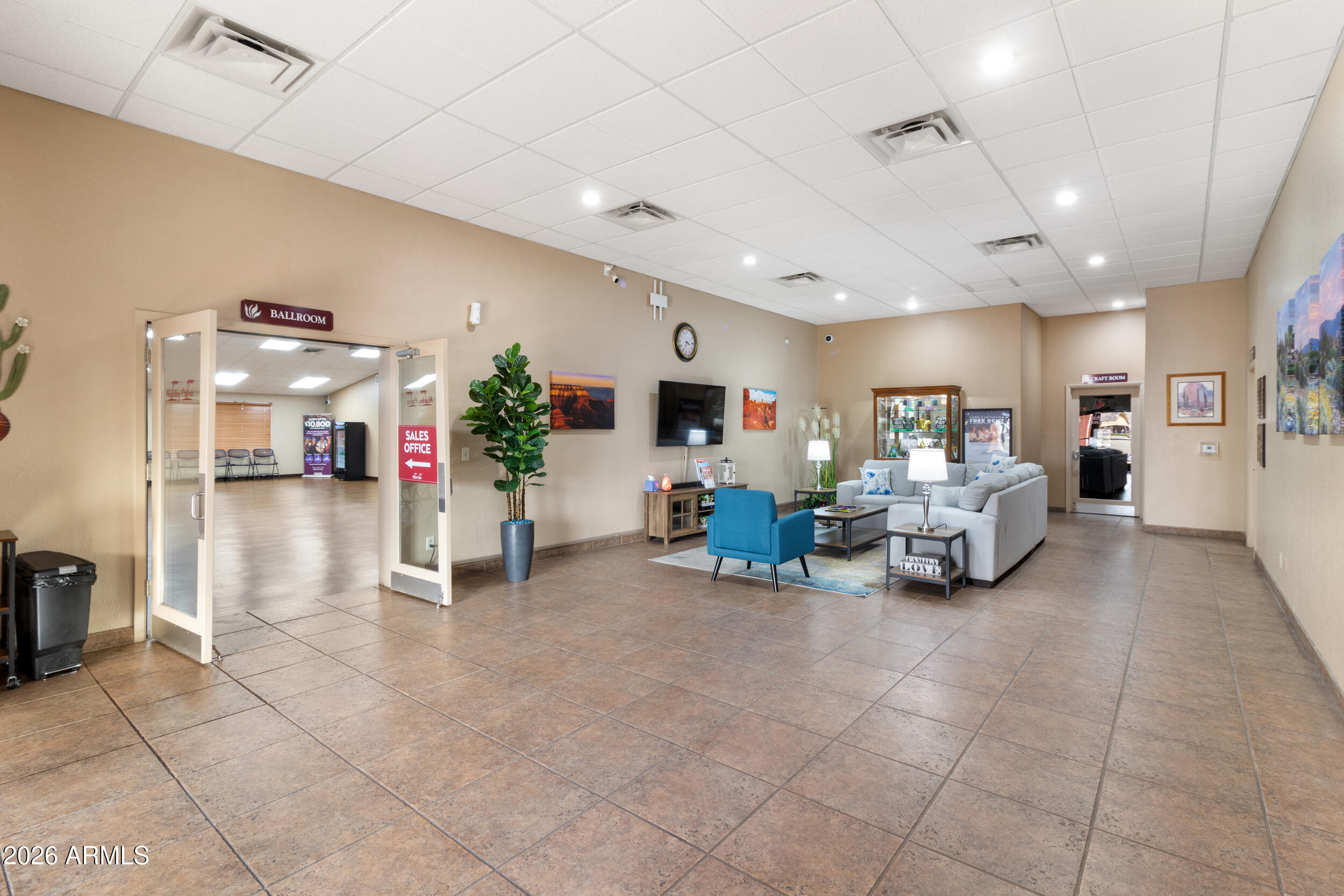 9302 East Broadway Road, Unit 178 Mesa, AZ 85208 - Photo 47 of 56 a living room with furniture and a chandelier