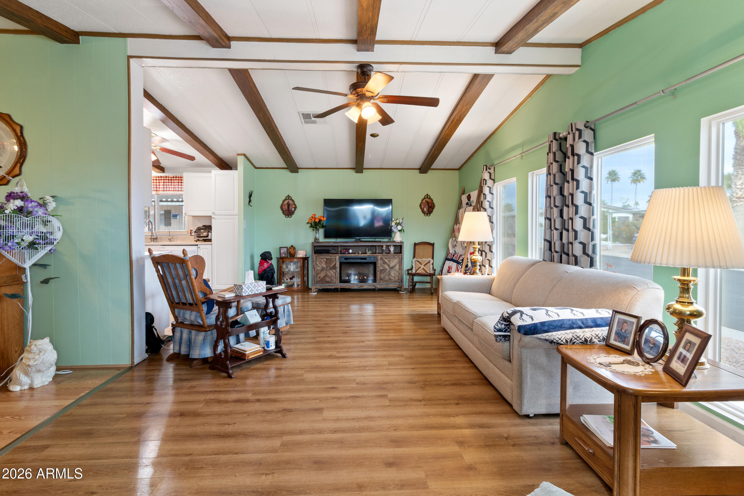 9302 East Broadway Road, Unit 178 Mesa, AZ 85208 - Photo 5 of 56 a living room with furniture and a flat screen tv