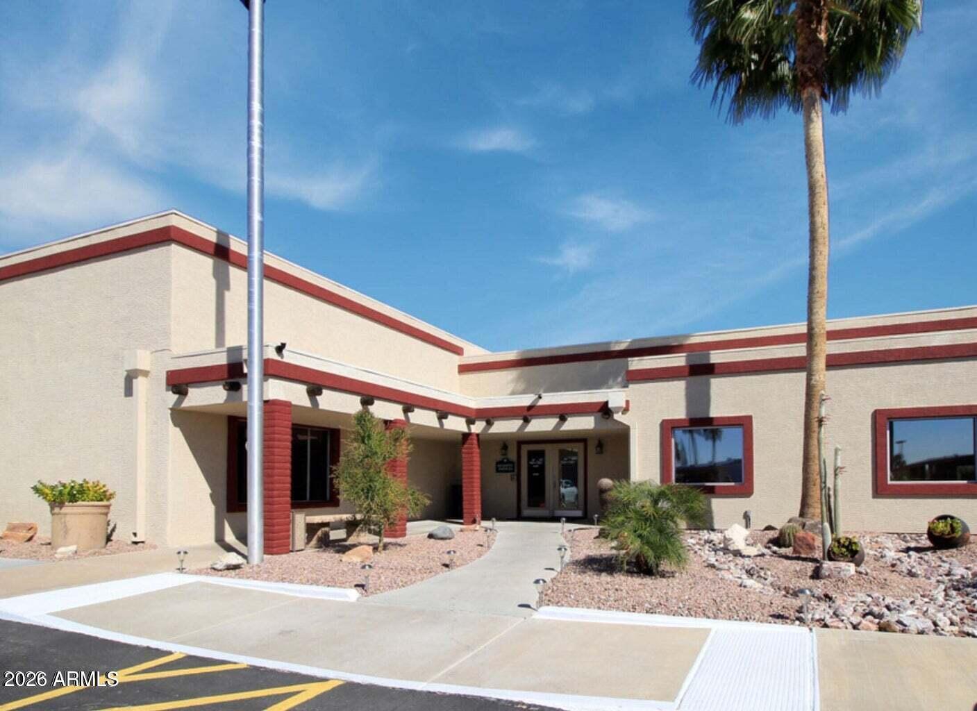9302 East Broadway Road, Unit 178 Mesa, AZ 85208 - Photo 51 of 56 a view of a building with a tree