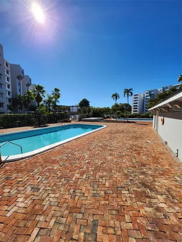 a view of a lake with a building in the background