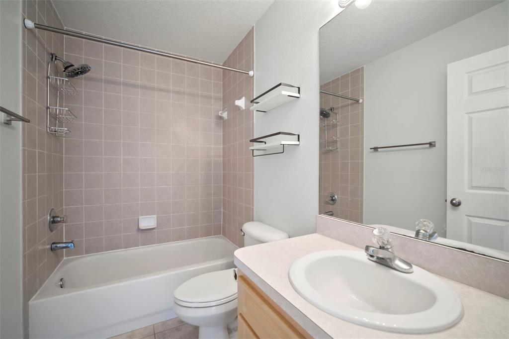 1013 Apollo Beach Boulevard, Unit 203 Apollo Beach, FL 33572 - Photo 20 of 26 a bathroom with a sink toilet and shower