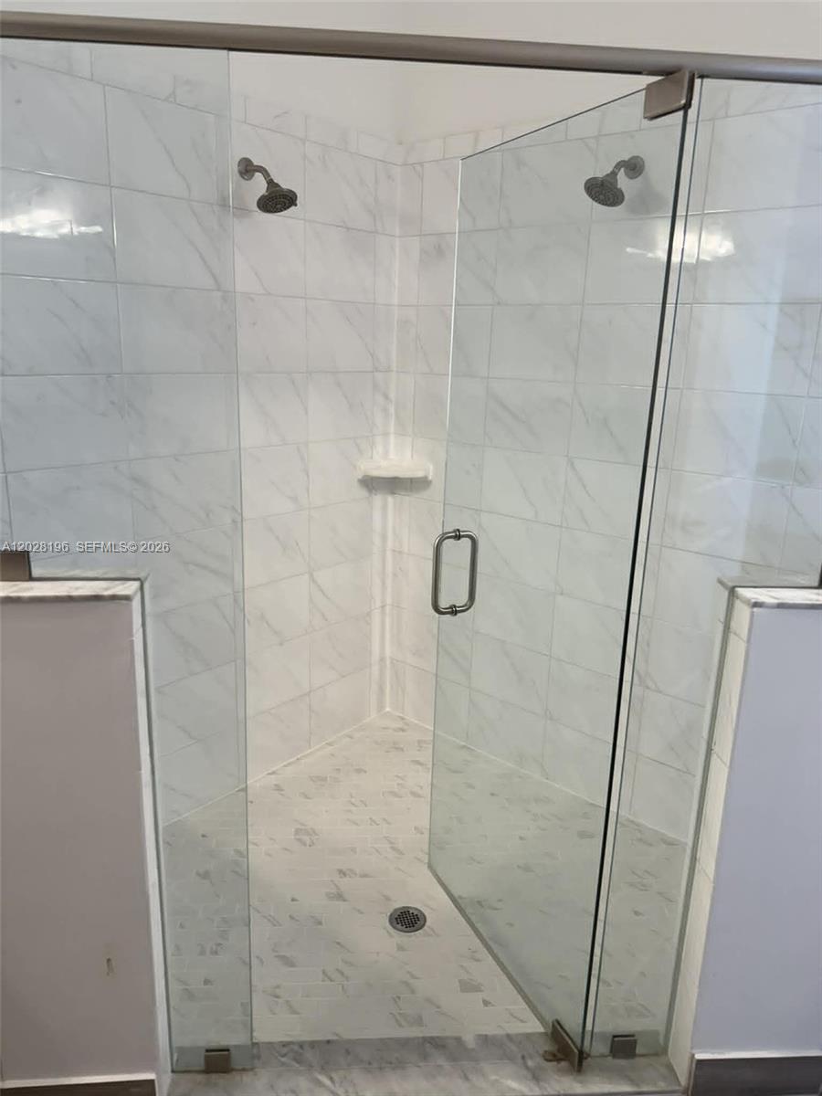 4710 Southwest Ardsley Drive Stuart, FL 34997 - Photo 6 of 7 a bathroom with a shower