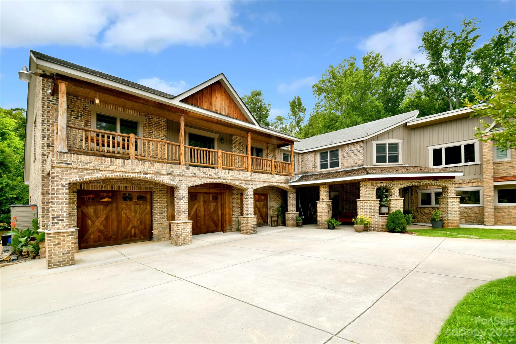 19201 Davidson-Concord Road Davidson, NC 28036 - Photo 1 of 47 a front view of a house with a garden