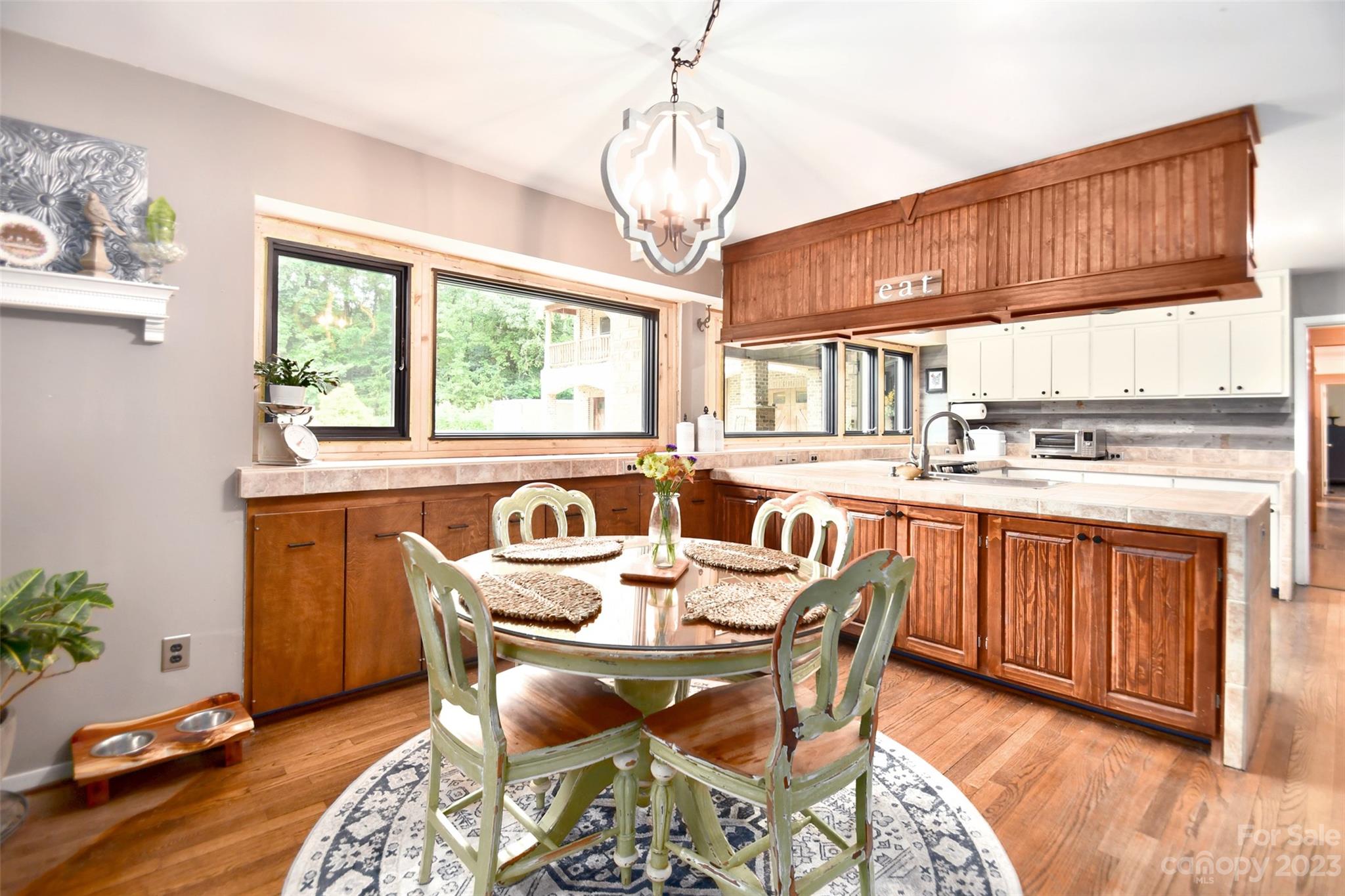 19201 Davidson-Concord Road Davidson, NC 28036 - Photo 13 of 47 a dining room with furniture a window and wooden floor