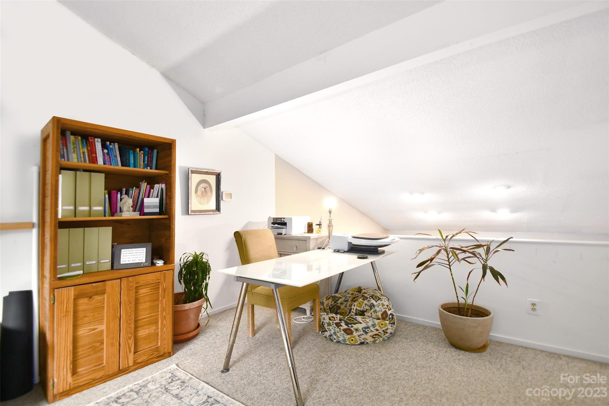 19201 Davidson-Concord Road Davidson, NC 28036 - Photo 16 of 47 a view of a livingroom with furniture and a book shelf