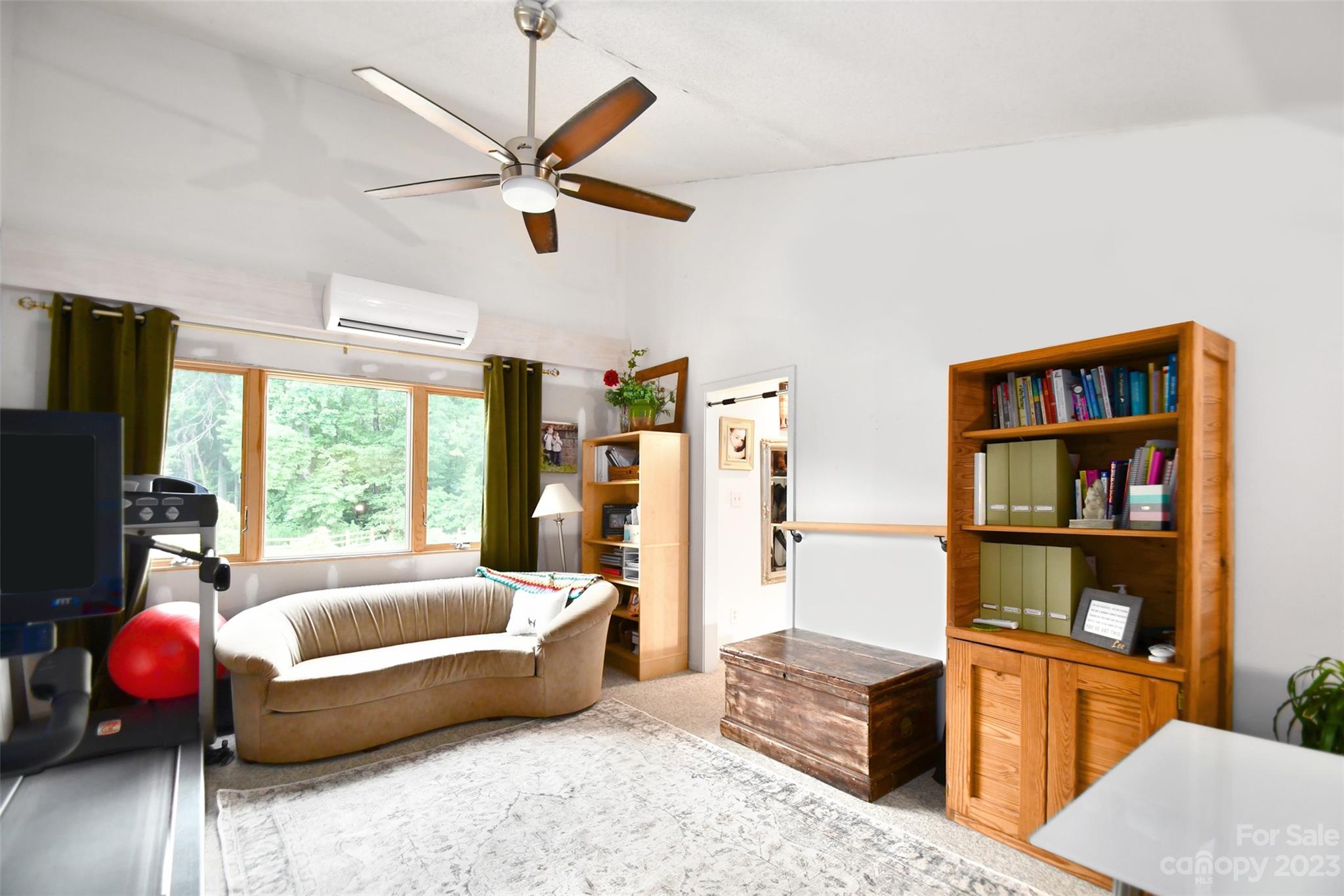 19201 Davidson-Concord Road Davidson, NC 28036 - Photo 17 of 47 a living room with furniture gym equipment and a window
